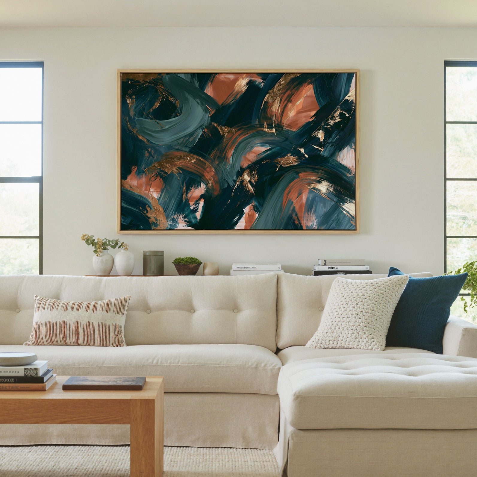 teal and copper abstract with sweeping arcs canvas wall art in a natural wood frame in a living room
