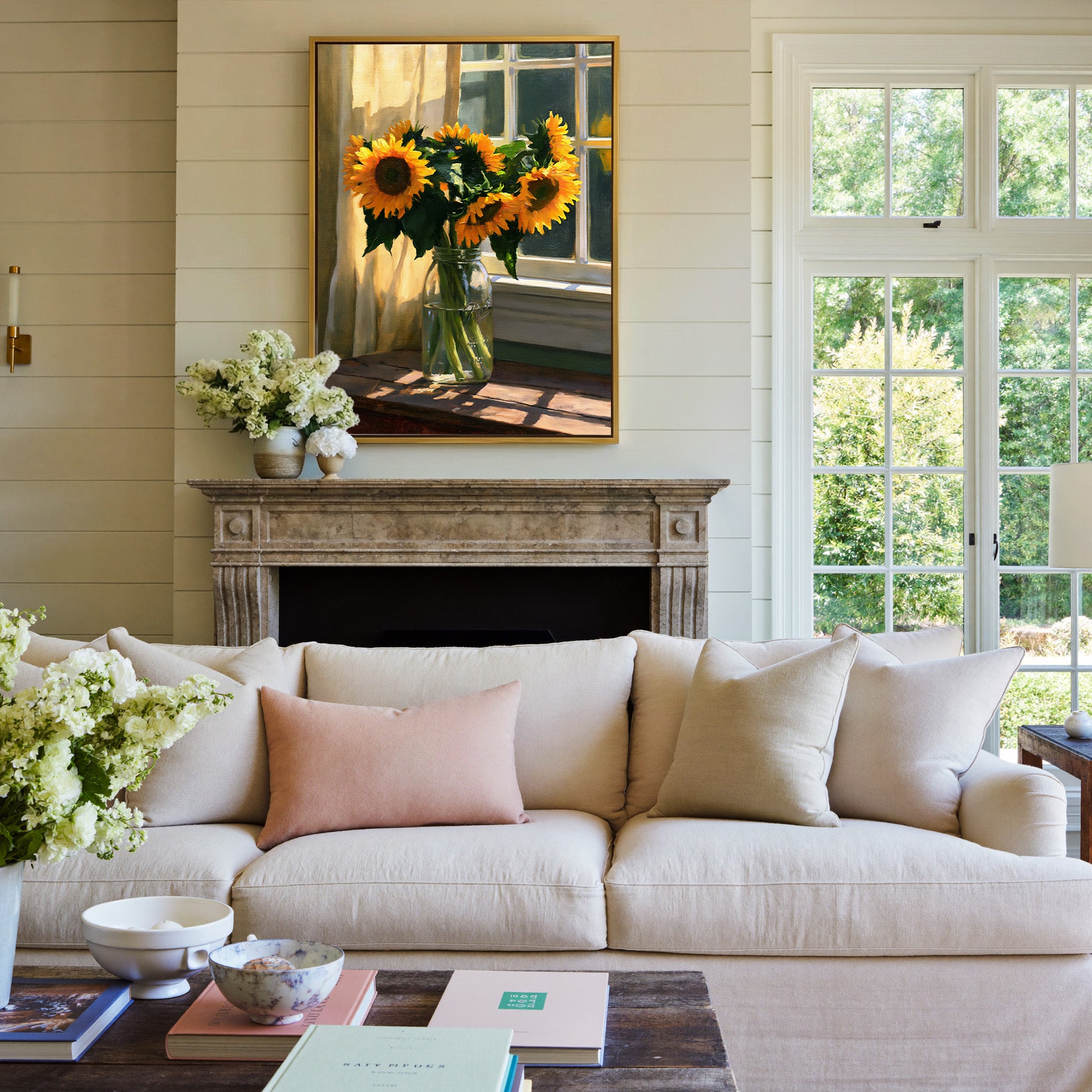 sunflowers in a glass jar by a sunlit window canvas wall art in a gold frame above a mantel