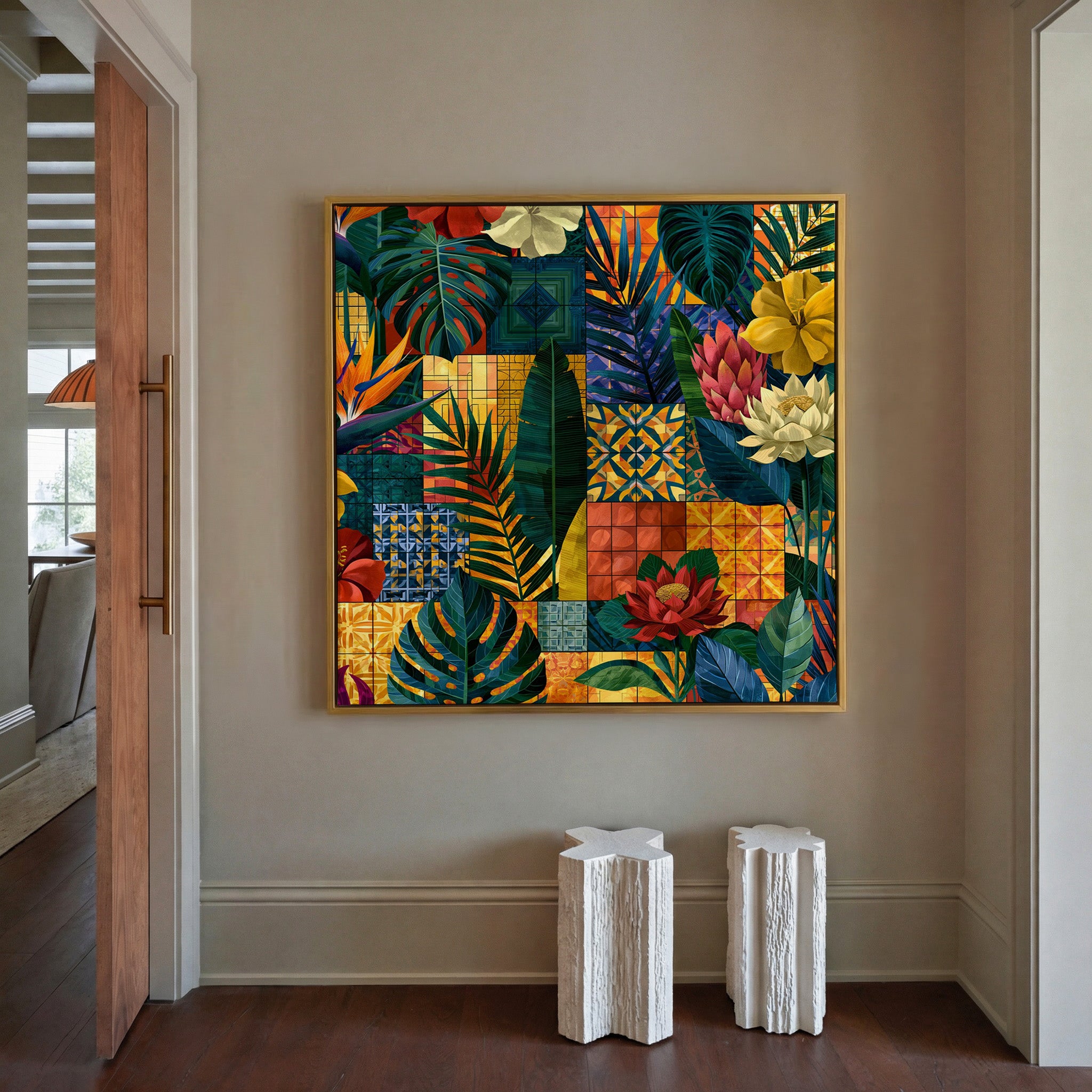 patterned tropical leaves and flowers with canvas wall art in a gold frame in a styled room setting