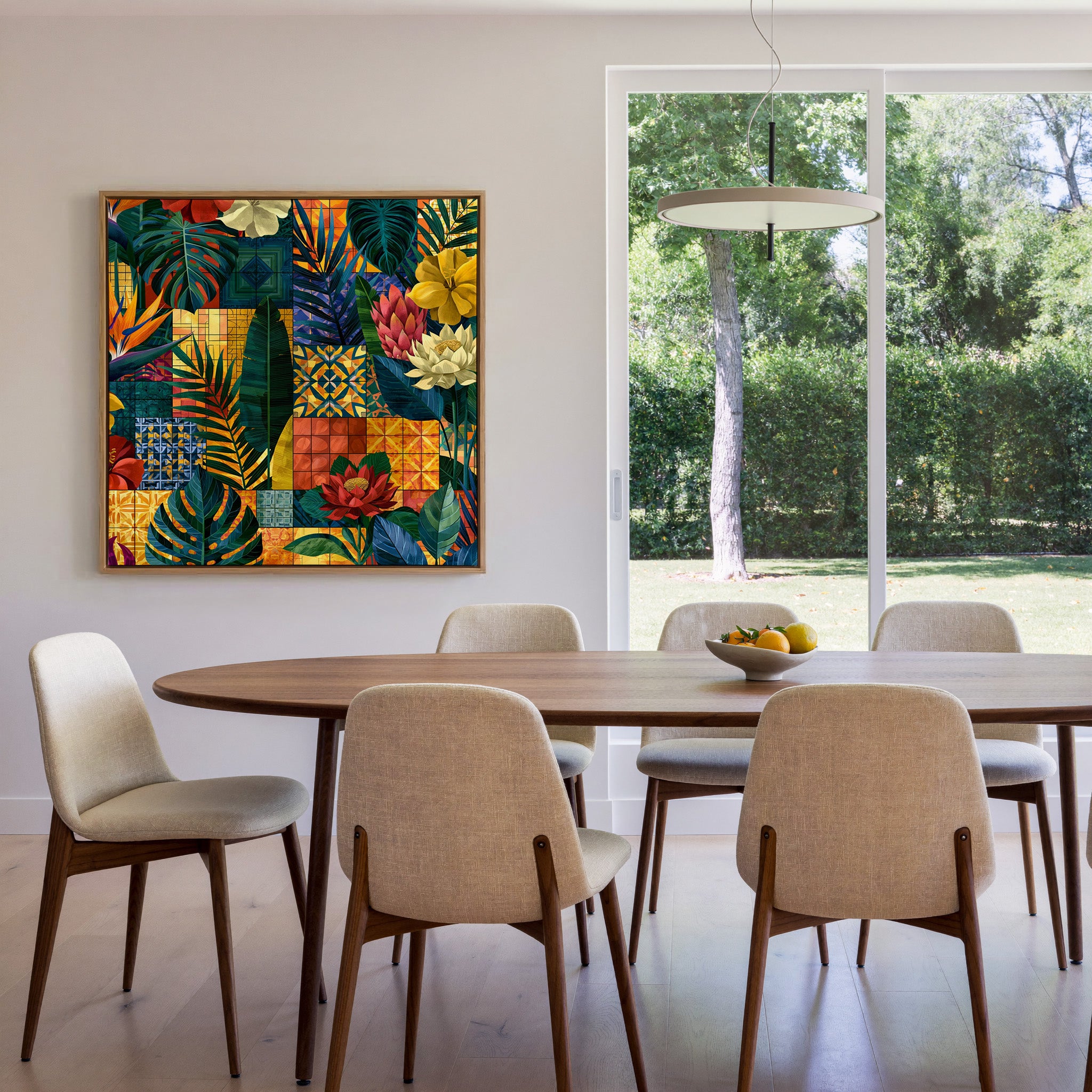 patterned tropical leaves and flowers with canvas wall art in an oak frame in a dining room
