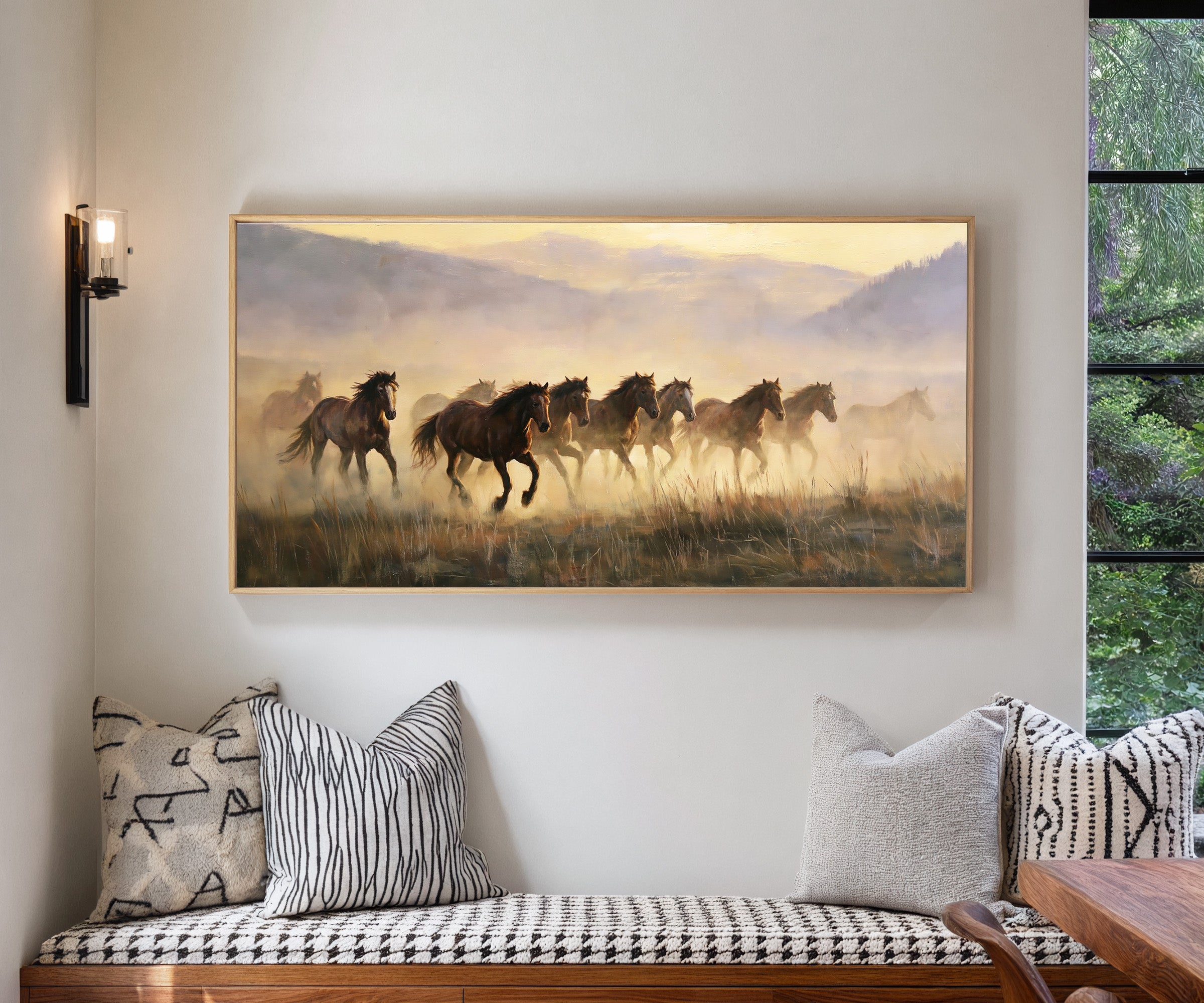 misty mustang herd at sunrise canvas wall art in a natural wood frame in a living room