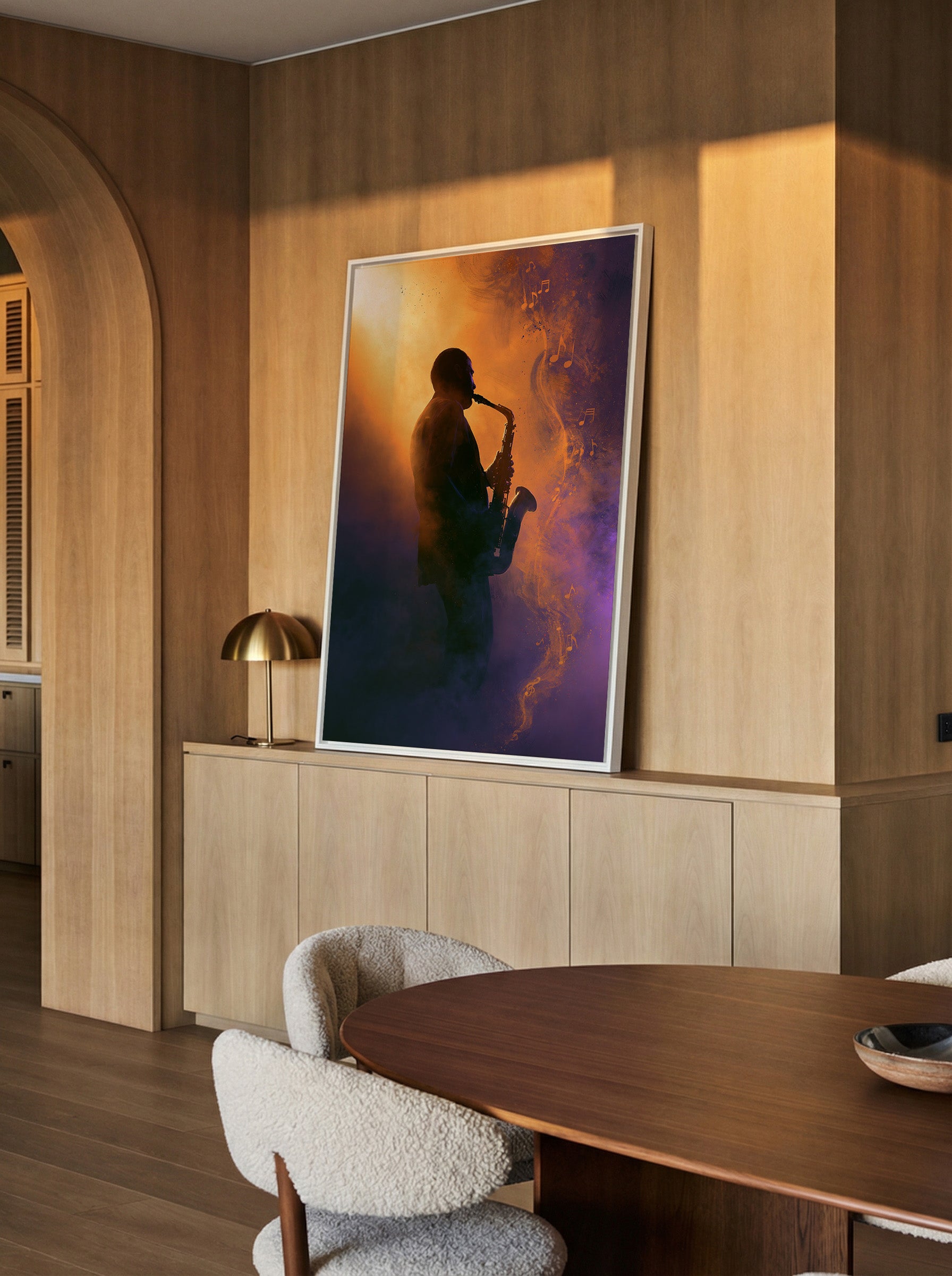 silhouetted saxophone player in orange and canvas wall art in a white frame in a styled room setting