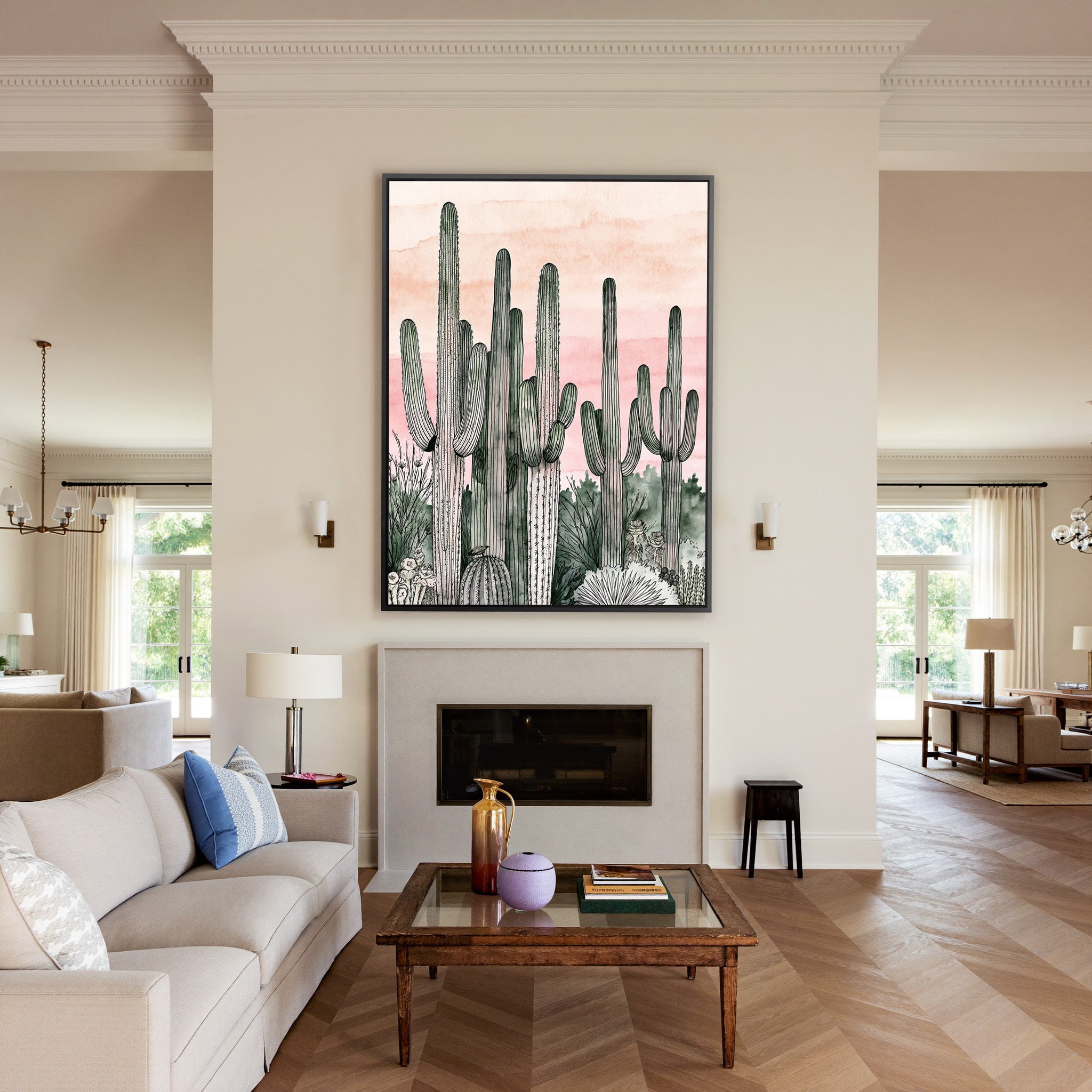 pink dusk sky with tall saguaro columns canvas wall art in a black frame above a mantel