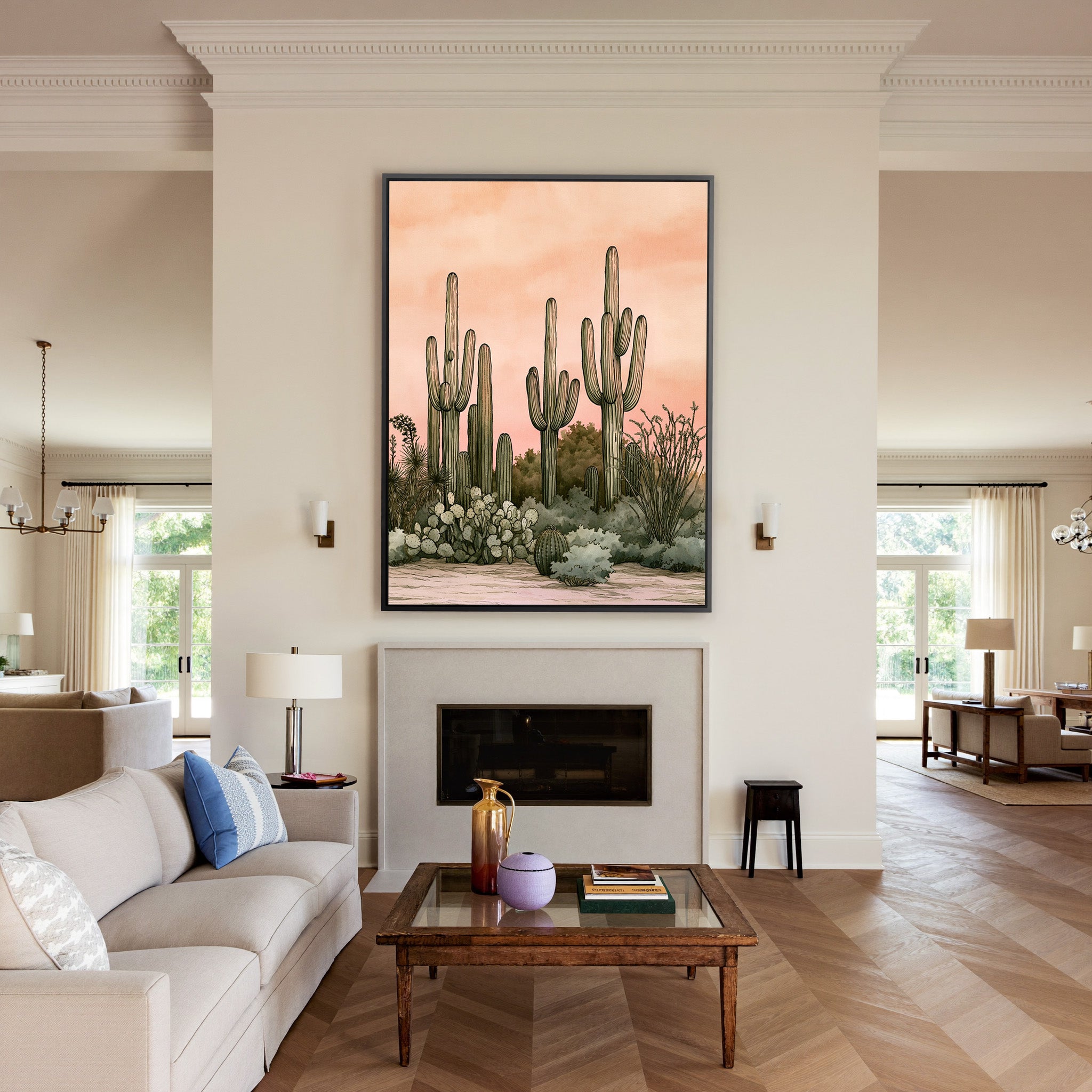 pink dusk desert cactus garden canvas wall art in a black frame above a mantel