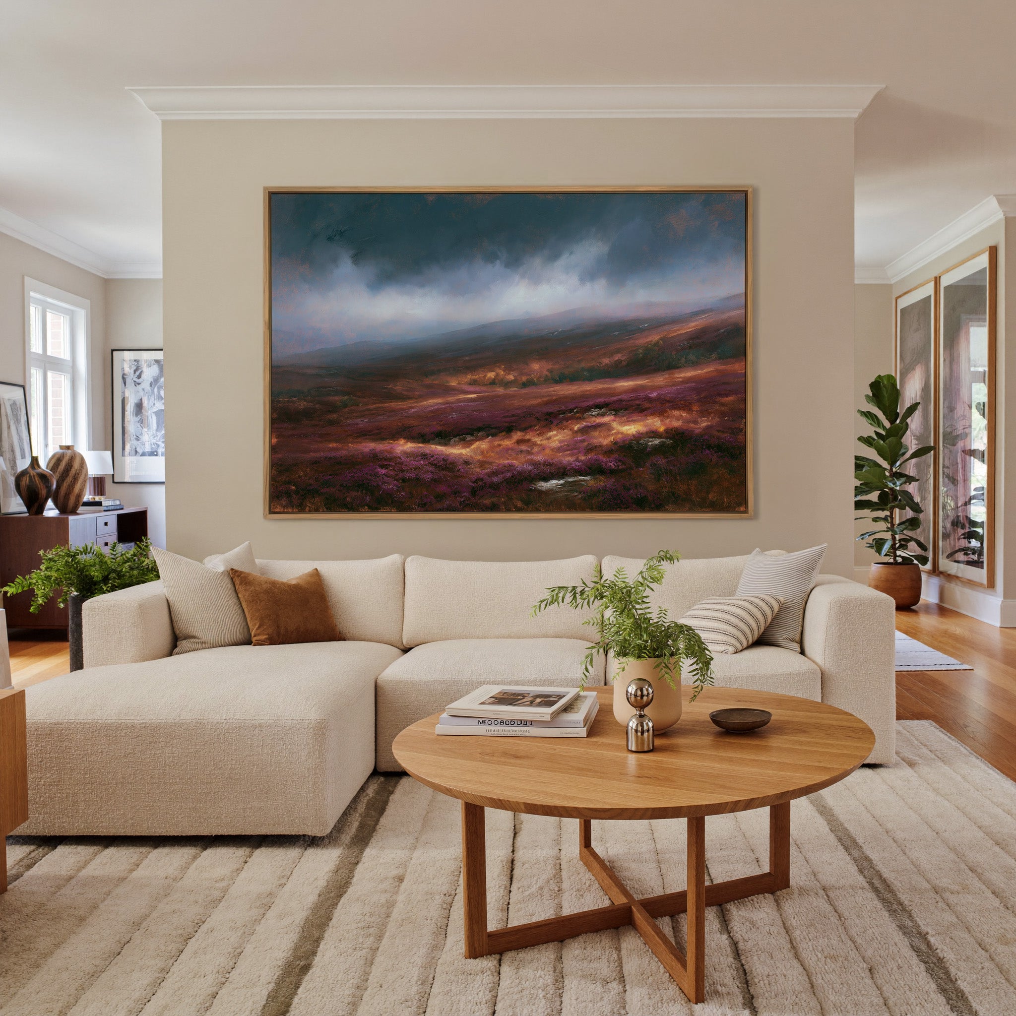 late autumn heather hills under a stormy sky canvas wall art in an oak frame in a living room