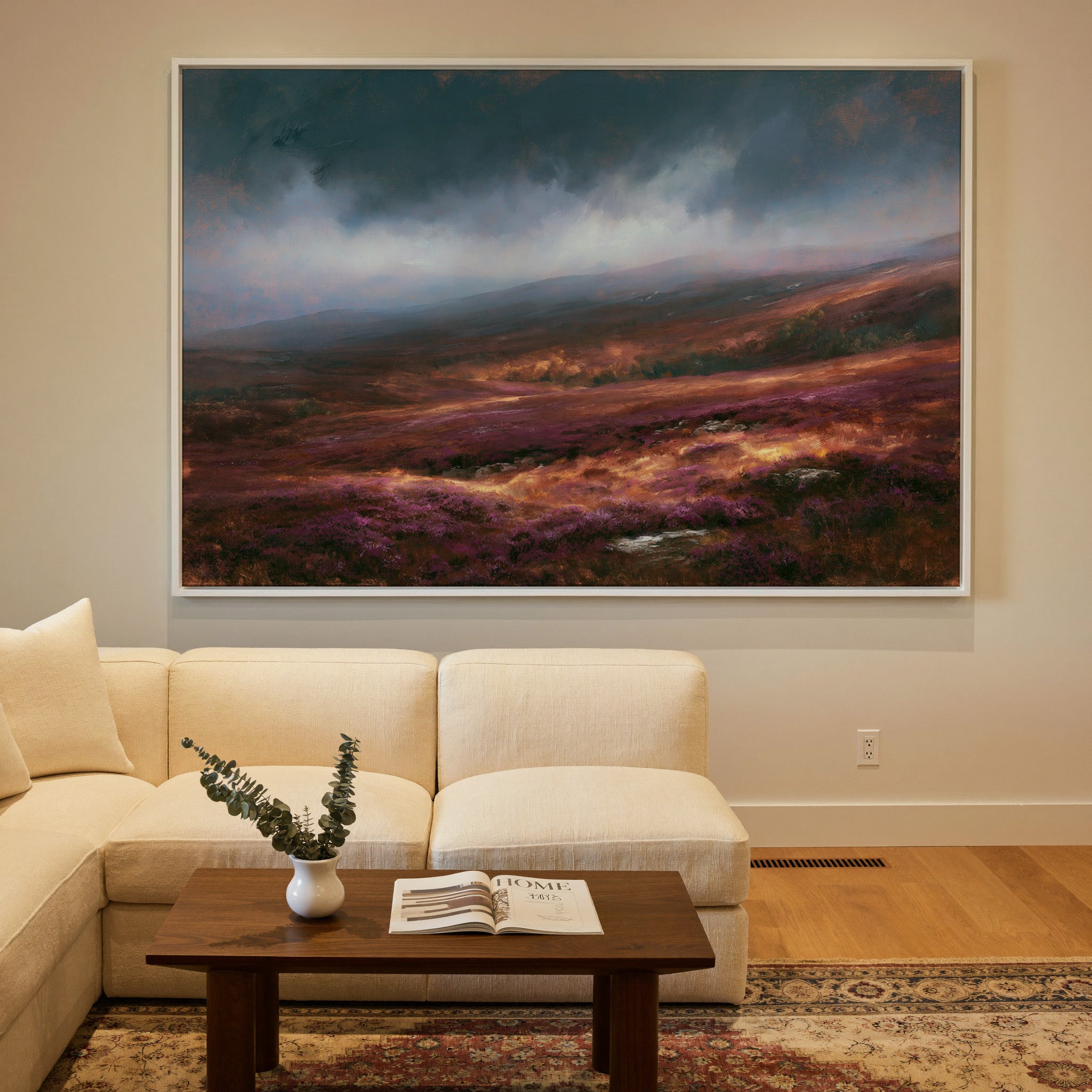 late autumn heather hills under a stormy sky canvas wall art in a white frame in a styled room setting