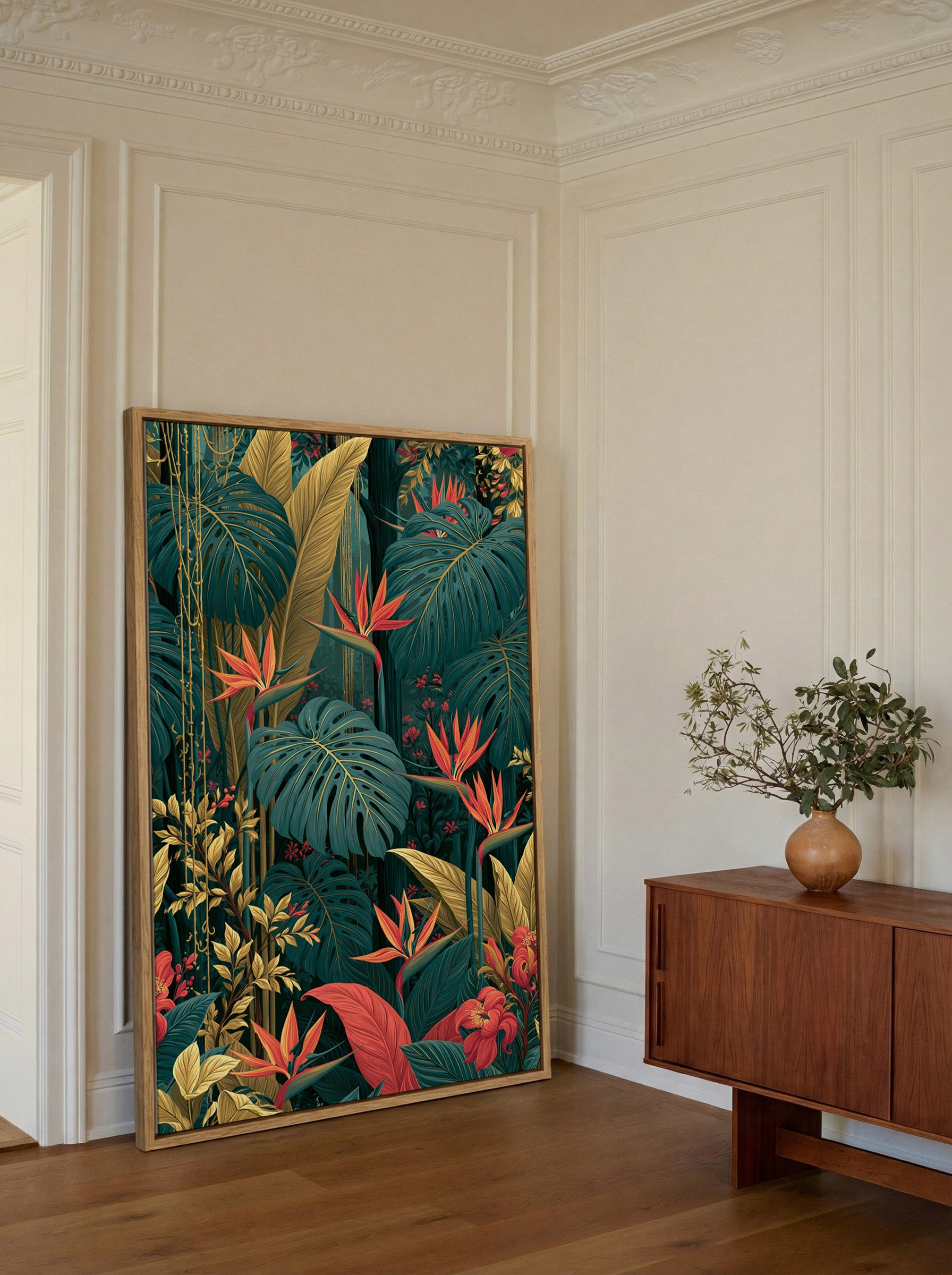 lush tropical jungle with giant monstera leaves canvas wall art in an oak frame in a styled room setting