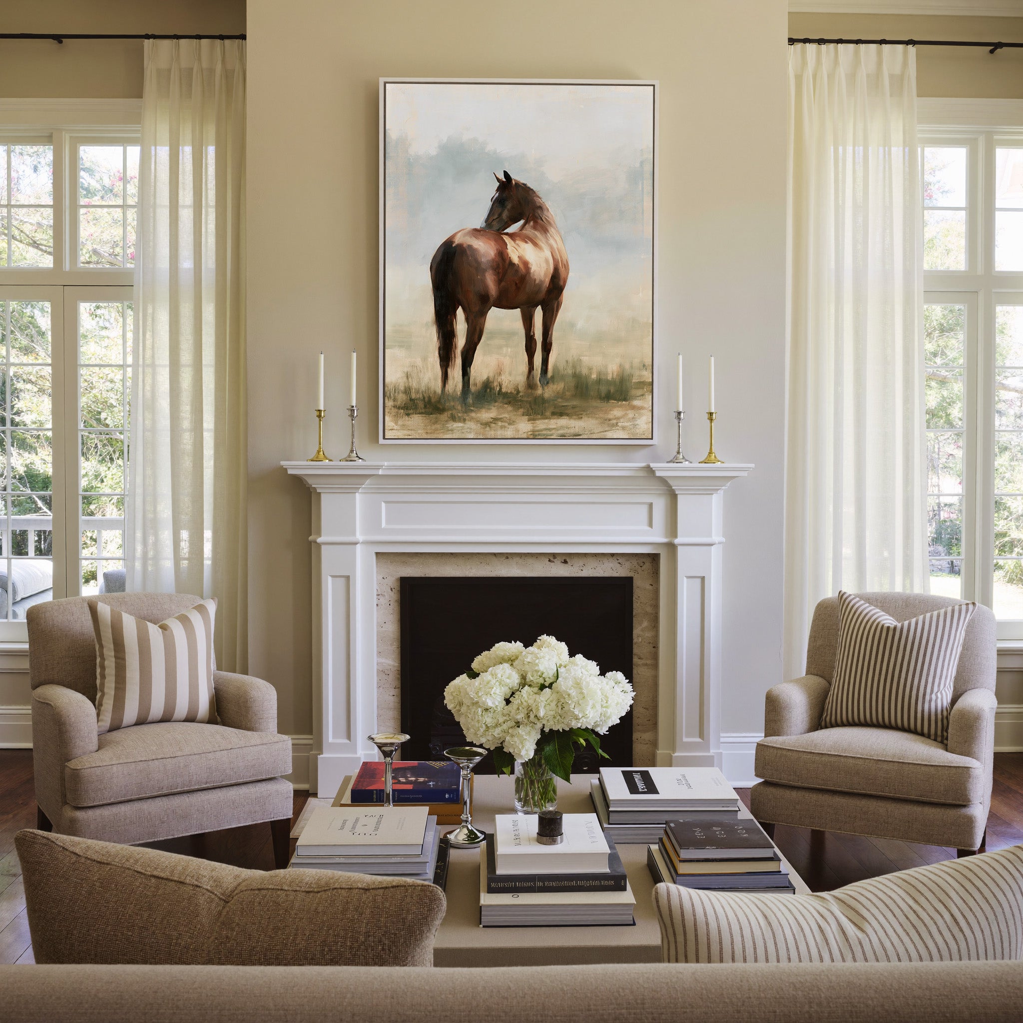 single chestnut horse in a pale open field canvas wall art in a white frame above a mantel