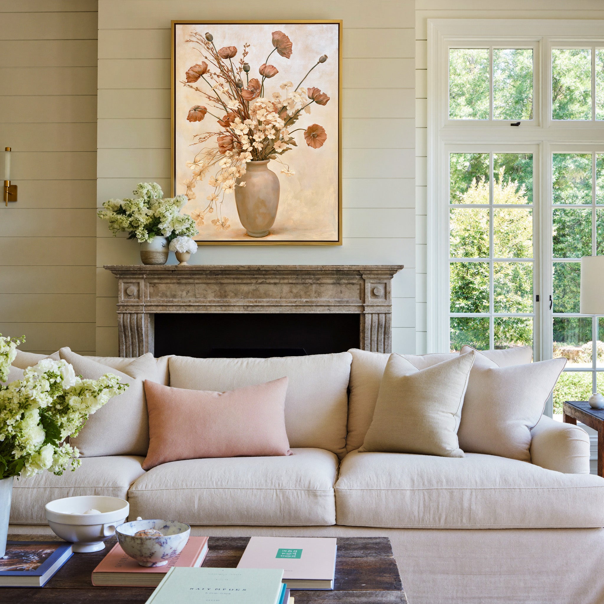 cream vase with dried poppies and pale blossoms canvas wall art in a gold frame above a mantel