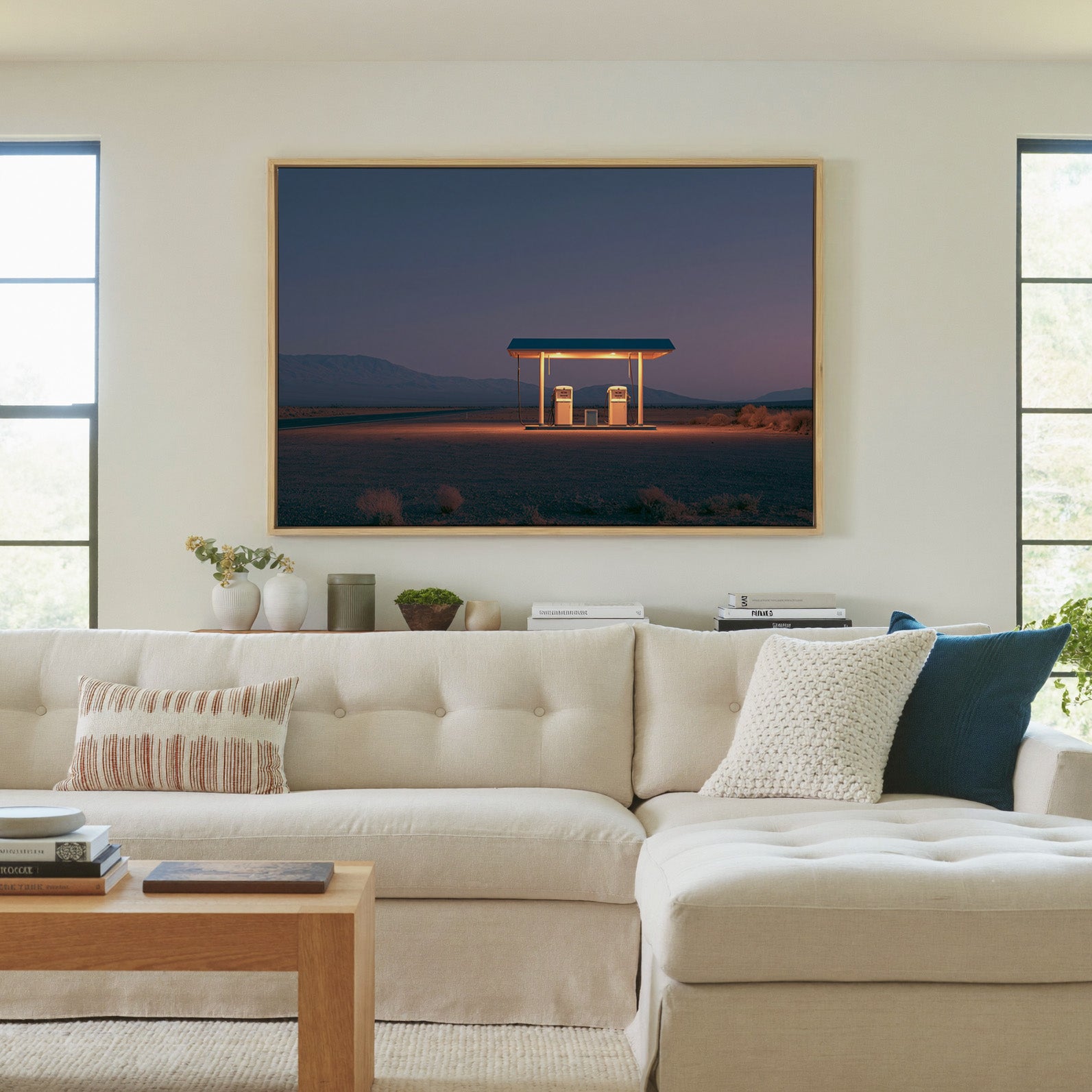 lonely desert gas station at blue hour canvas wall art in a natural wood frame in a living room