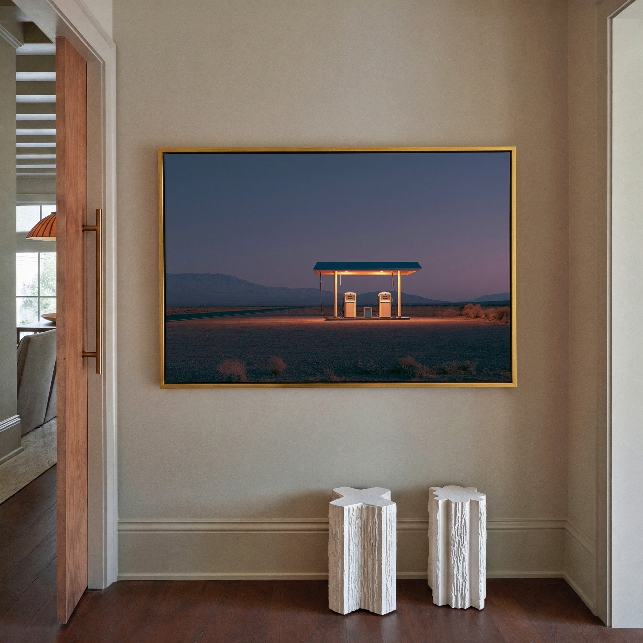 lonely desert gas station at blue hour canvas wall art in a gold frame in a styled room setting
