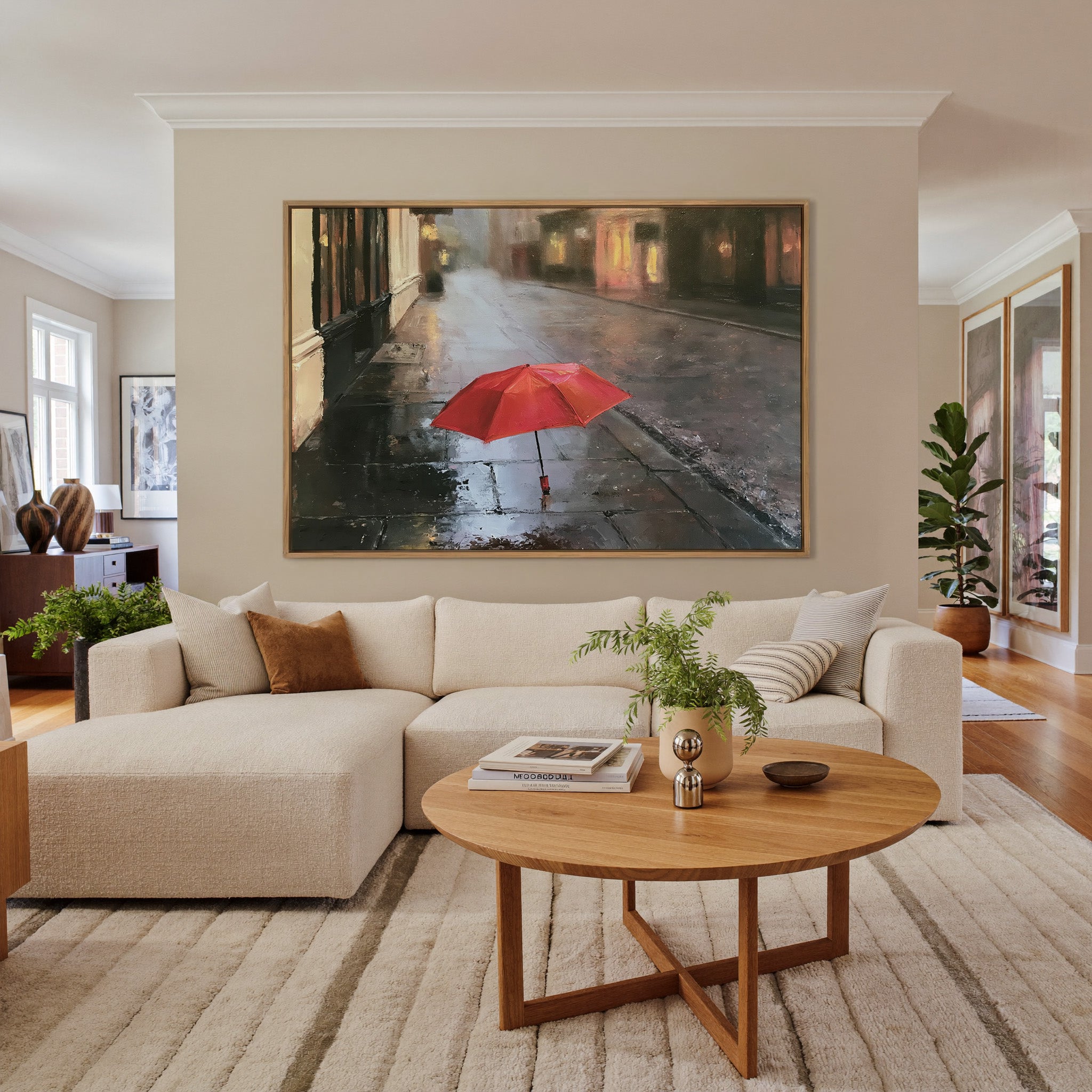 small red umbrella on a wet sidewalk canvas wall art in an oak frame in a living room