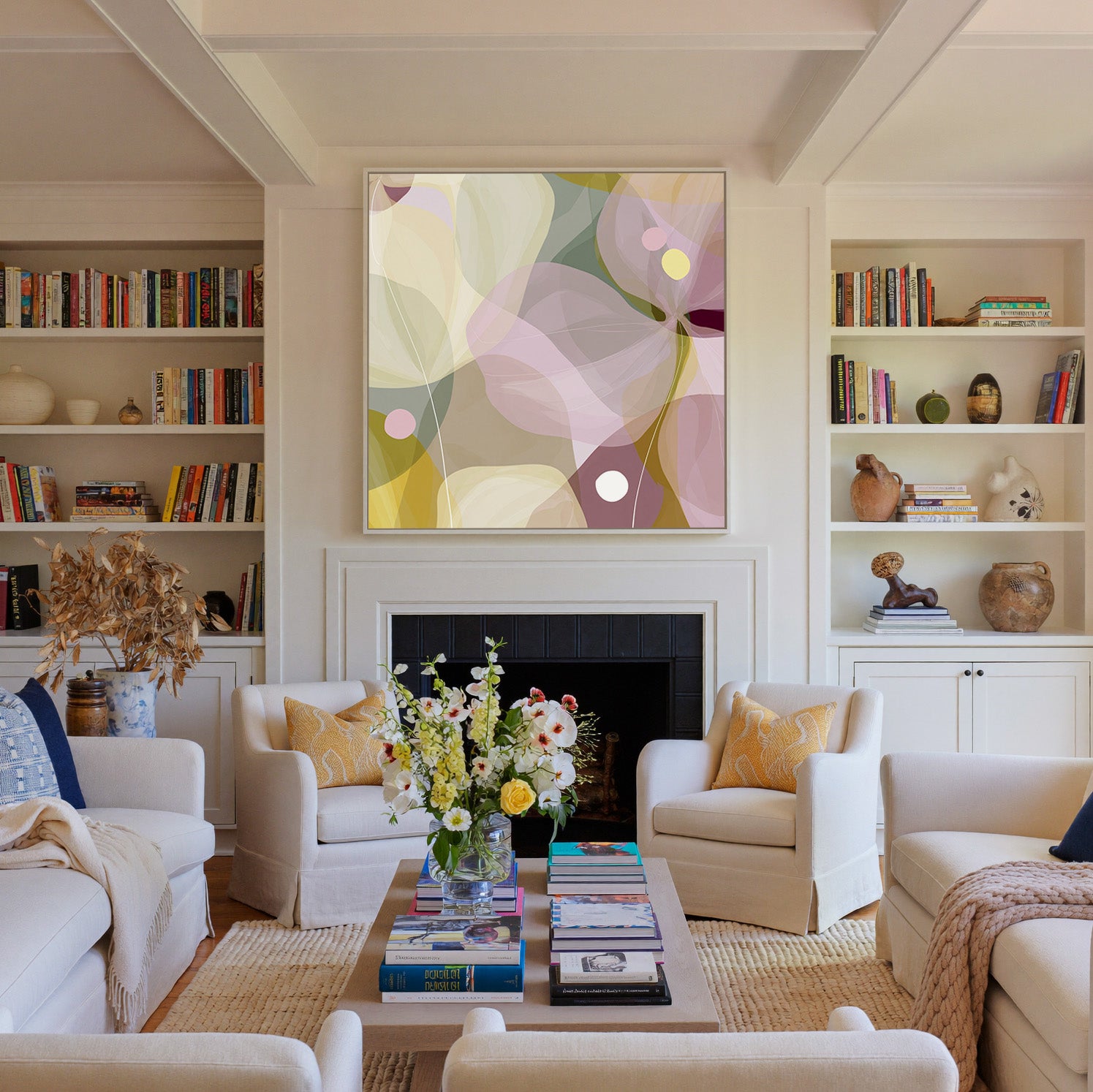soft translucent petals in blush, cream, and canvas wall art in a white frame above a fireplace