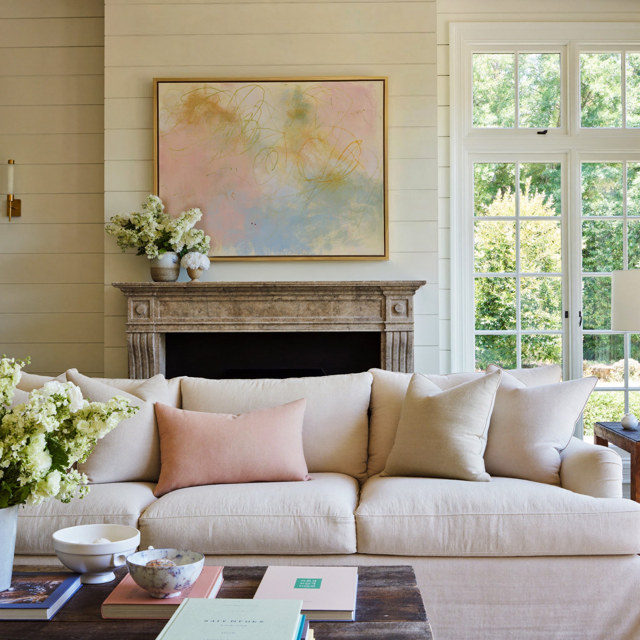 soft pastel abstract with looping lines canvas wall art in a gold frame above a mantel