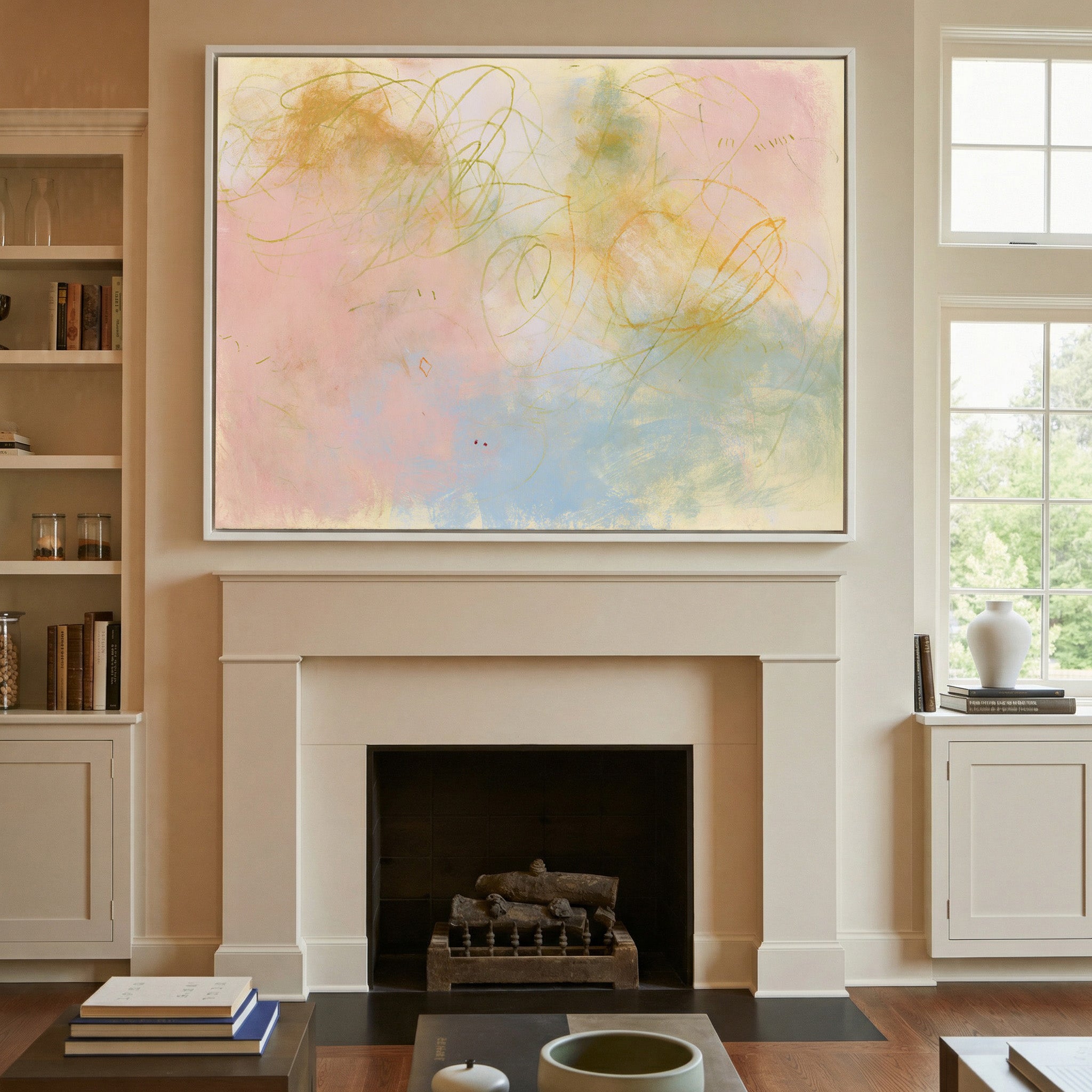 soft pastel abstract with looping lines canvas wall art in a white frame above a mantel