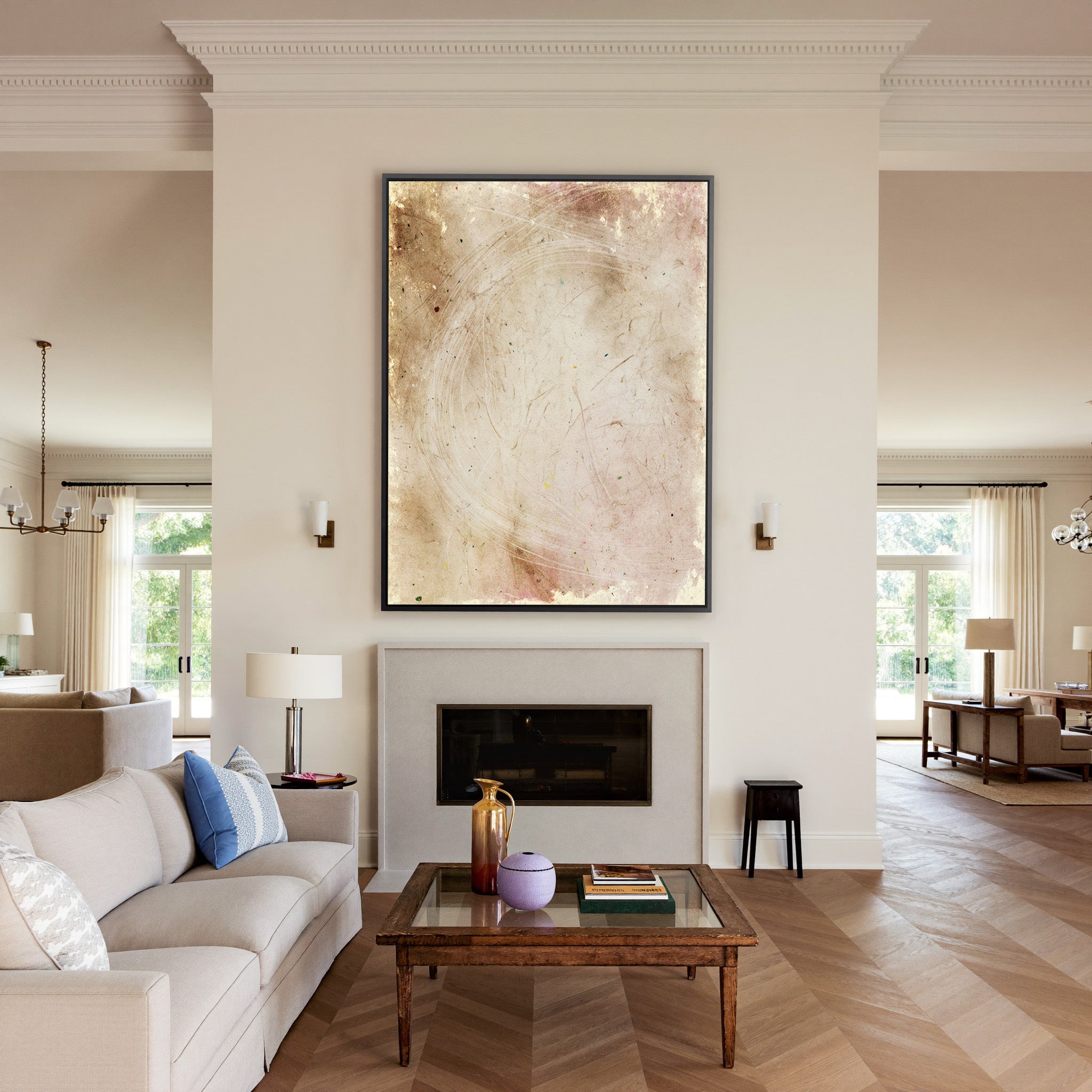 warm beige abstract with pale curved lines canvas wall art in a black frame above a mantel