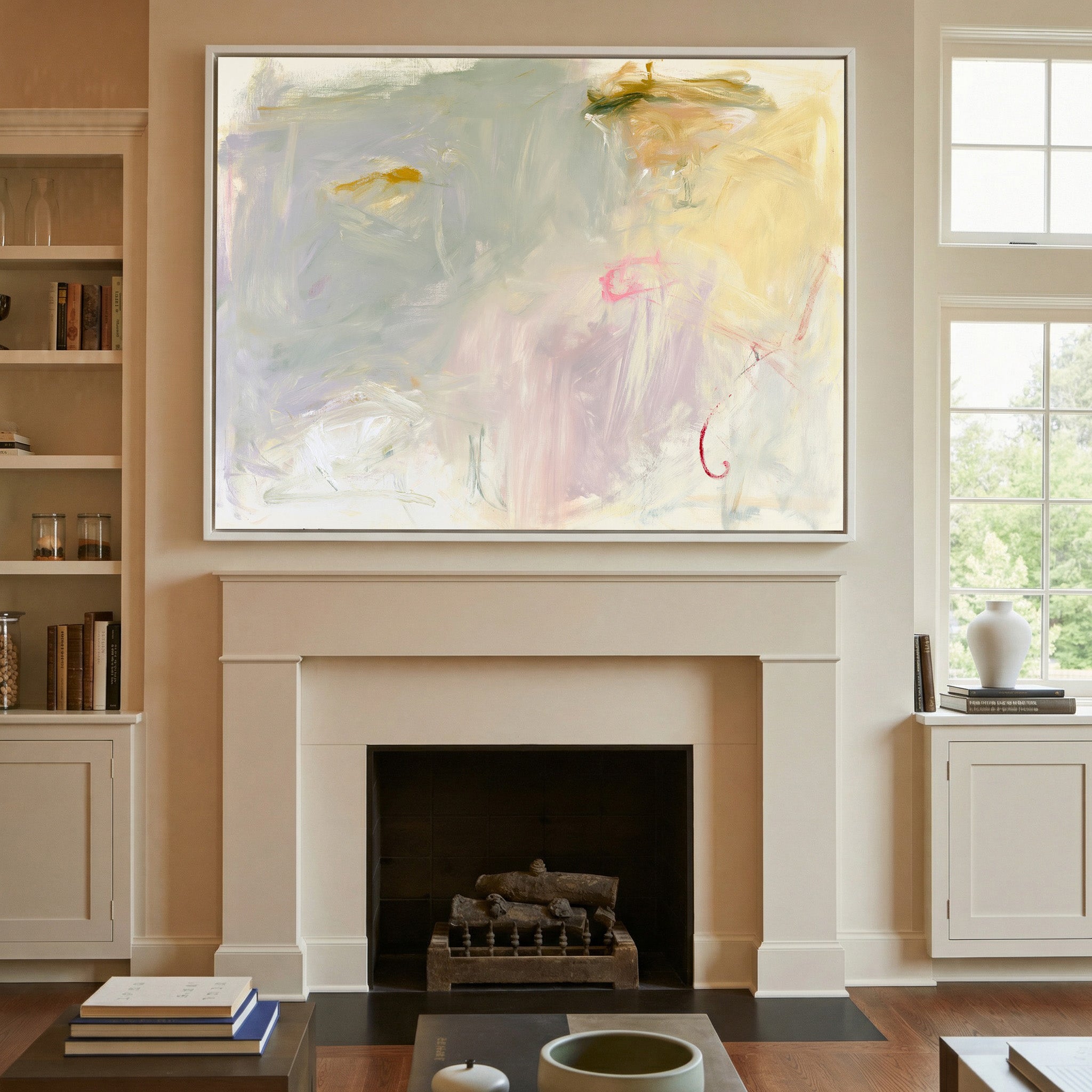 pale cream, blush, and sage abstract canvas wall art in a white frame above a mantel