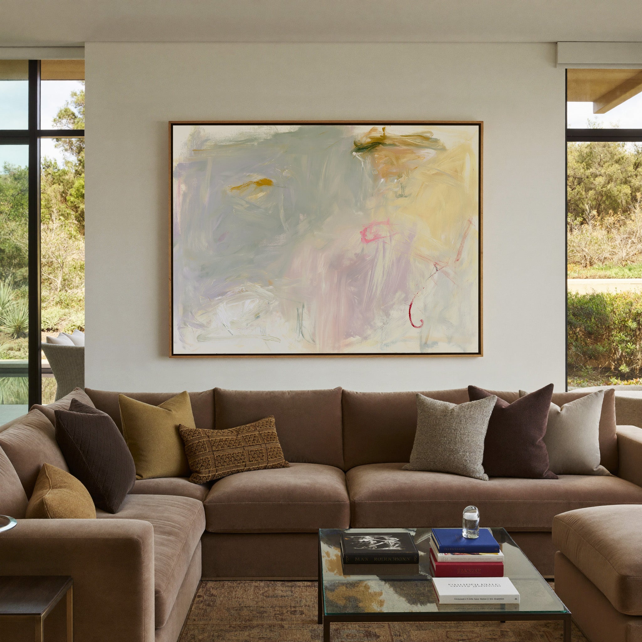 pale cream, blush, and sage abstract canvas wall art in an oak frame in a styled room setting