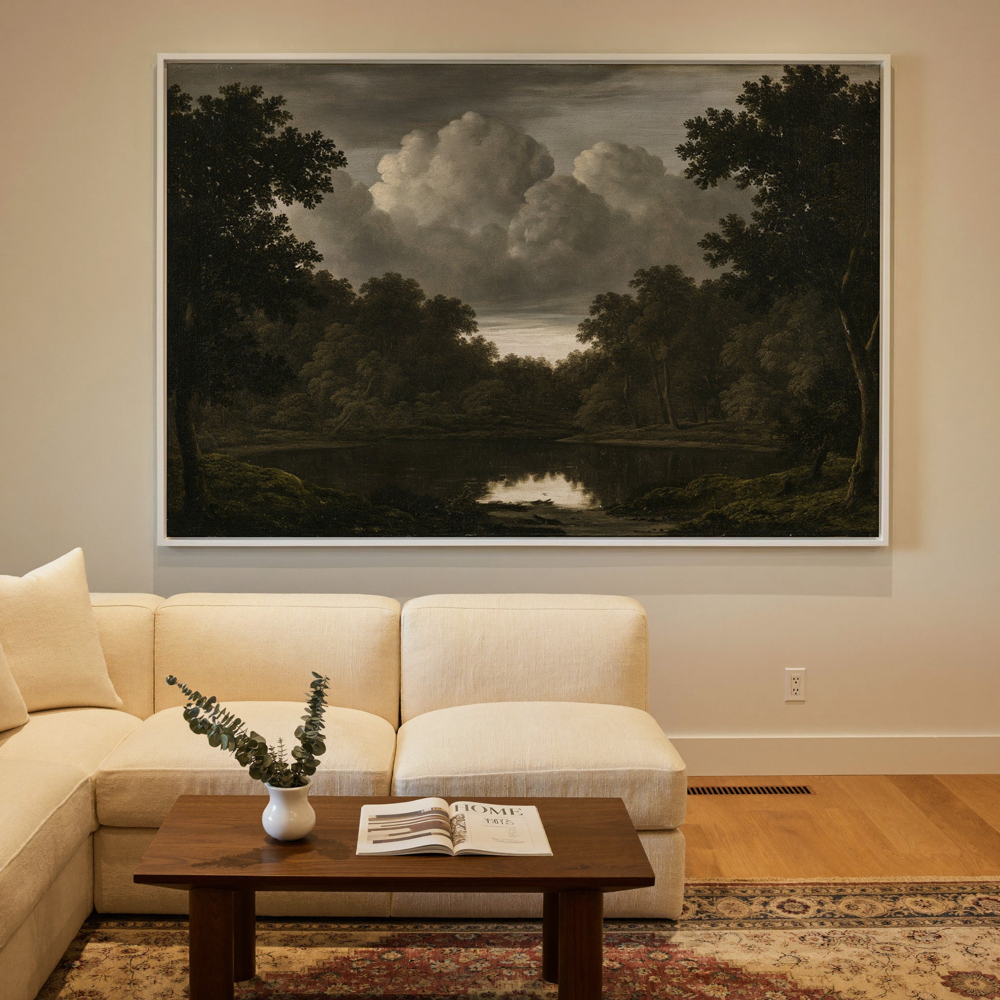 dark woodland pool beneath heavy storm clouds canvas wall art in a white frame in a styled room setting