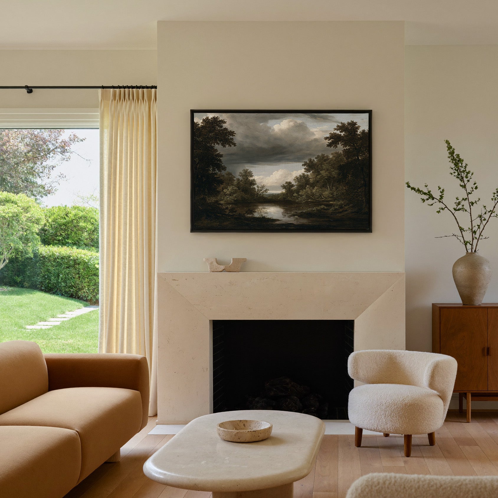 dark woodland pool under heavy storm clouds canvas wall art in a black frame above a mantel