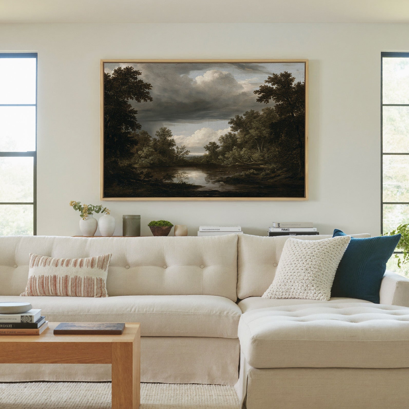 dark woodland pool under heavy storm clouds canvas wall art in a natural wood frame in a living room