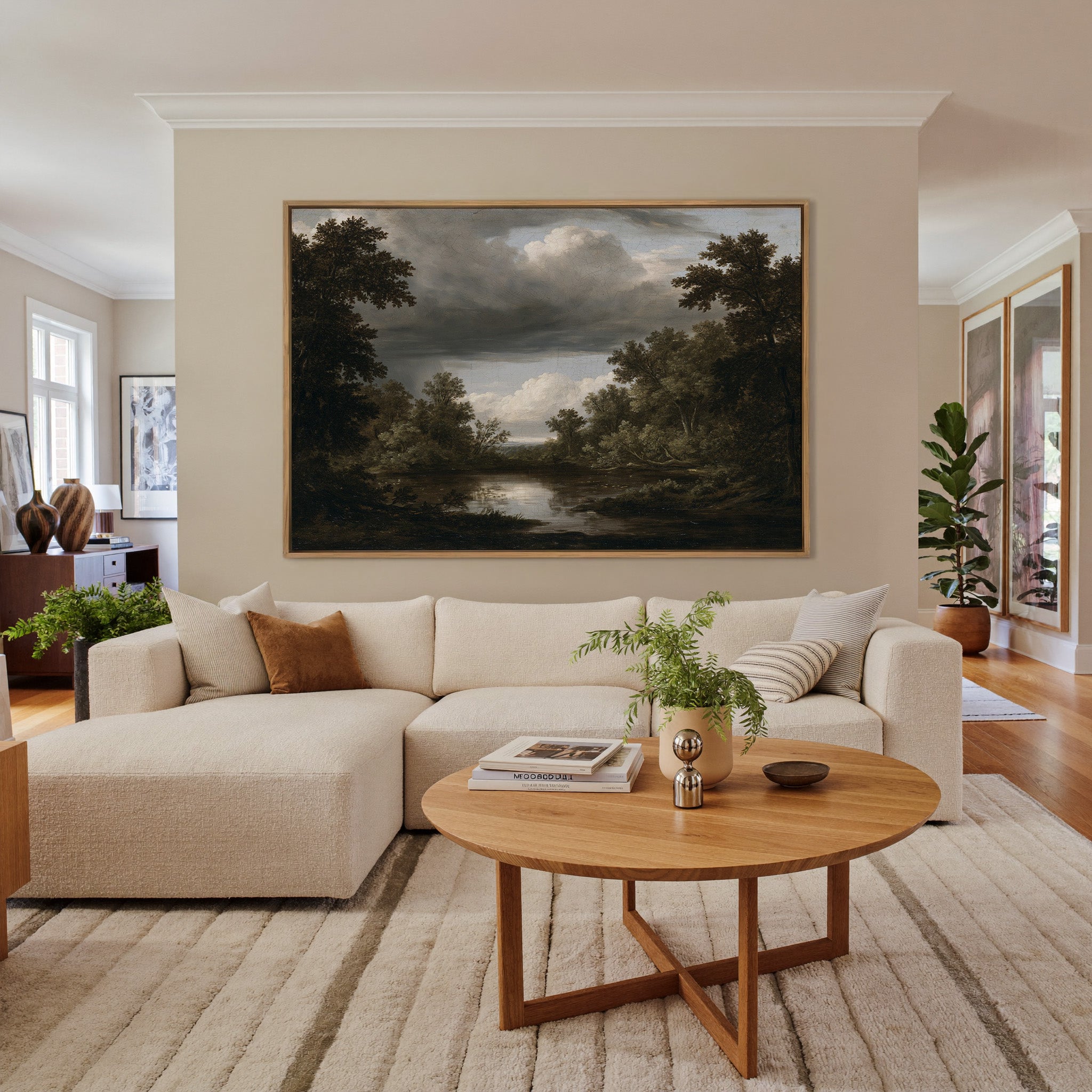 dark woodland pool under heavy storm clouds canvas wall art in an oak frame in a living room