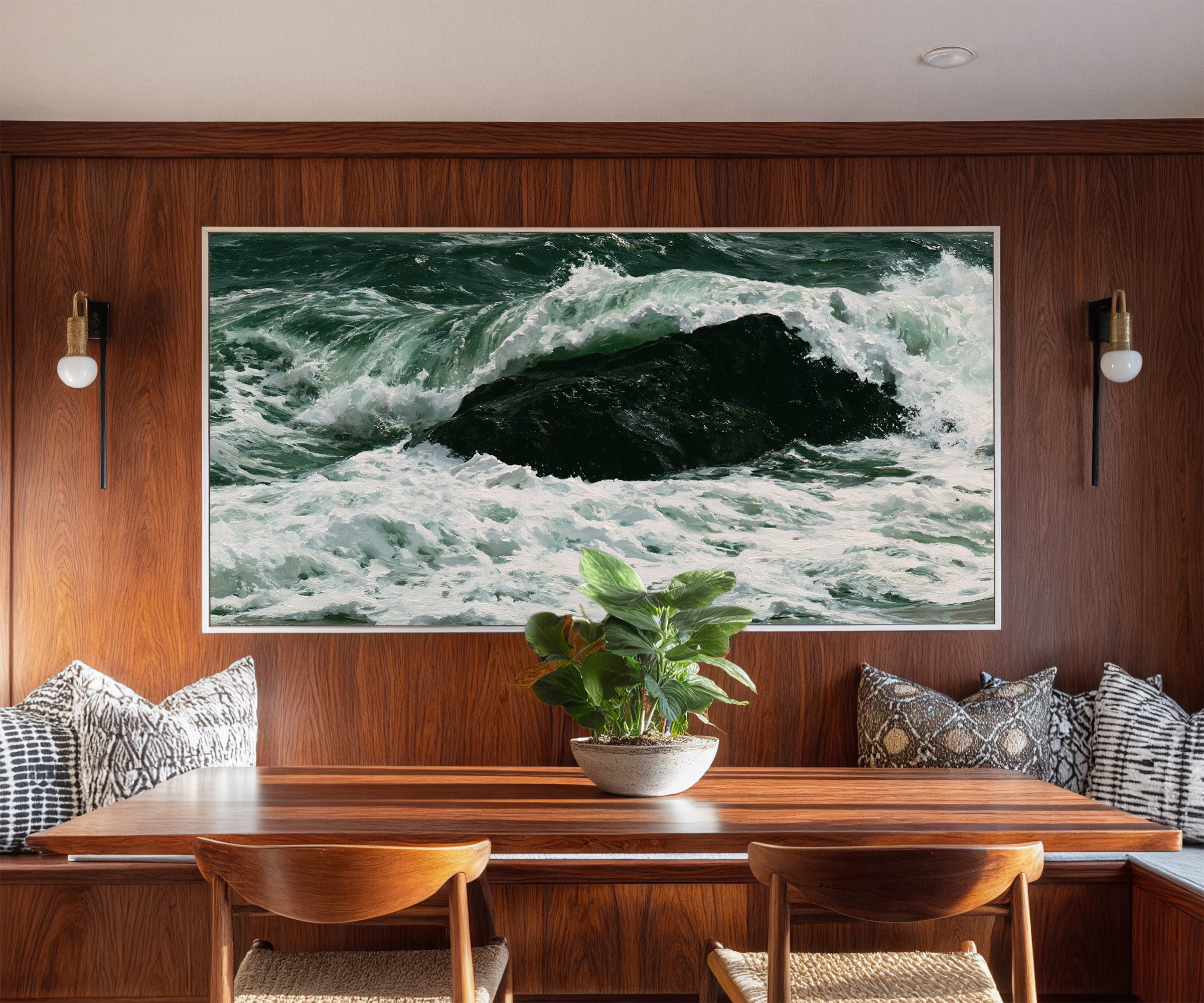 dark atlantic wave breaking over black rock canvas wall art in a white frame in a styled room setting