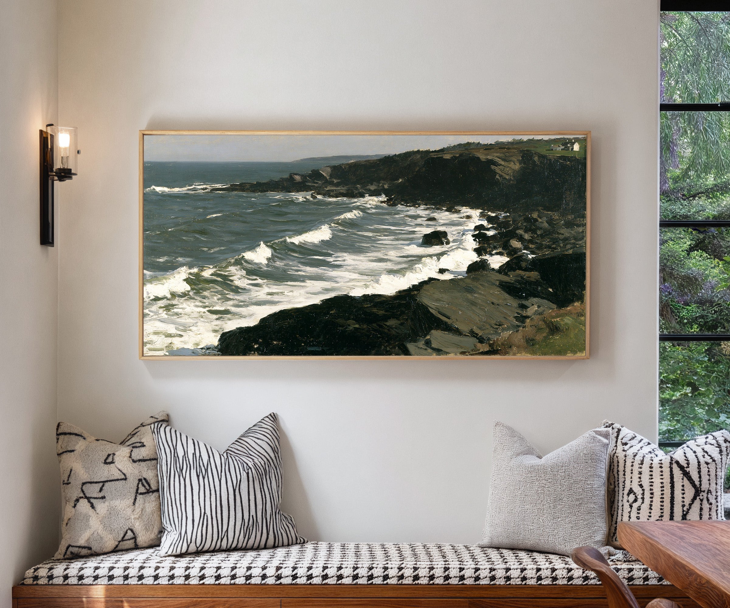 dark headland with white surf canvas wall art in a natural wood frame in a living room