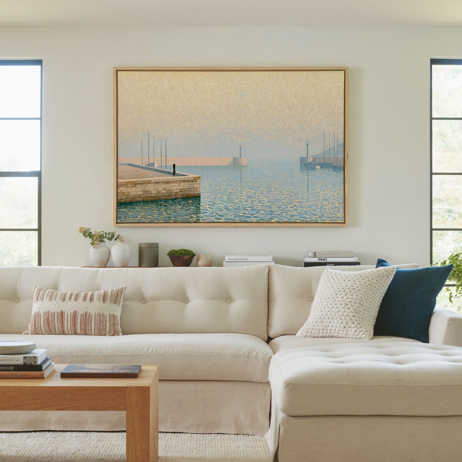 pale geometric harbor with stone pier and soft canvas wall art in a natural wood frame in a living room