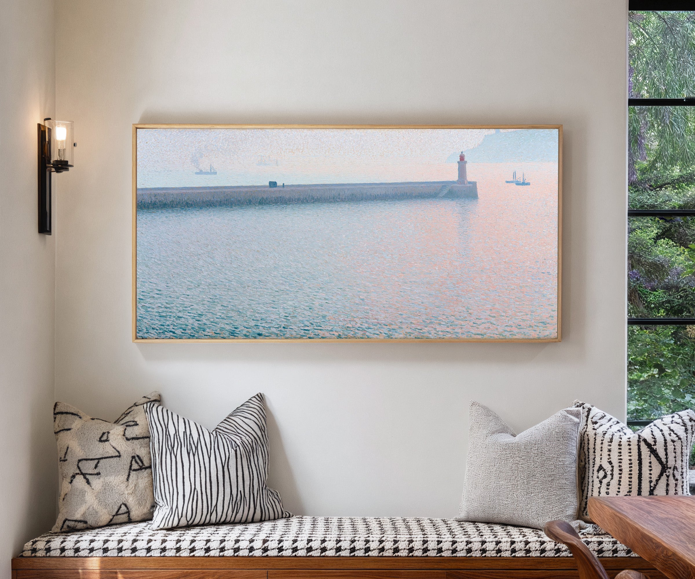 long harbor wall with a lighthouse and soft canvas wall art in a natural wood frame in a living room