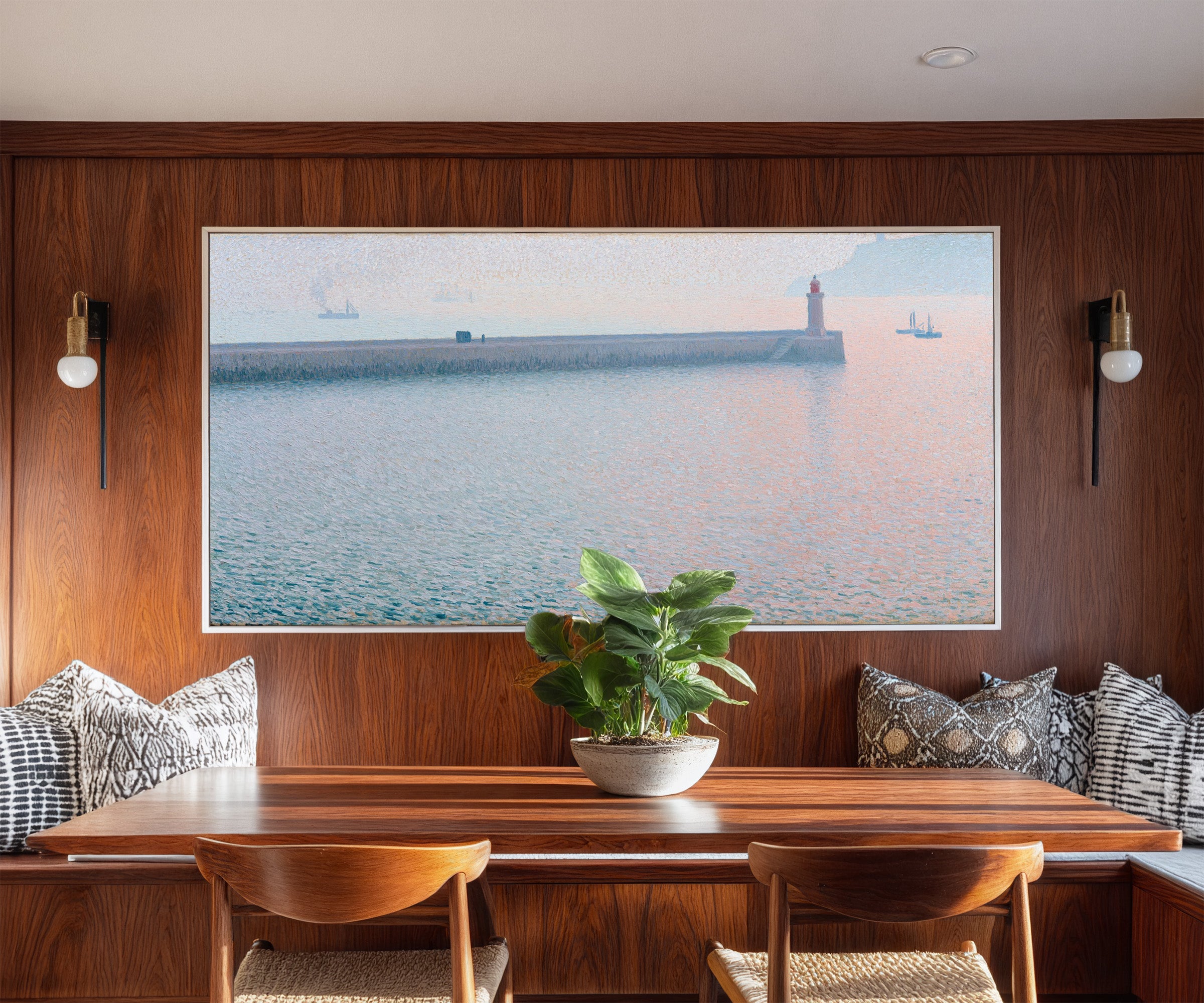 long harbor wall with a lighthouse and soft canvas wall art in a white frame in a styled room setting