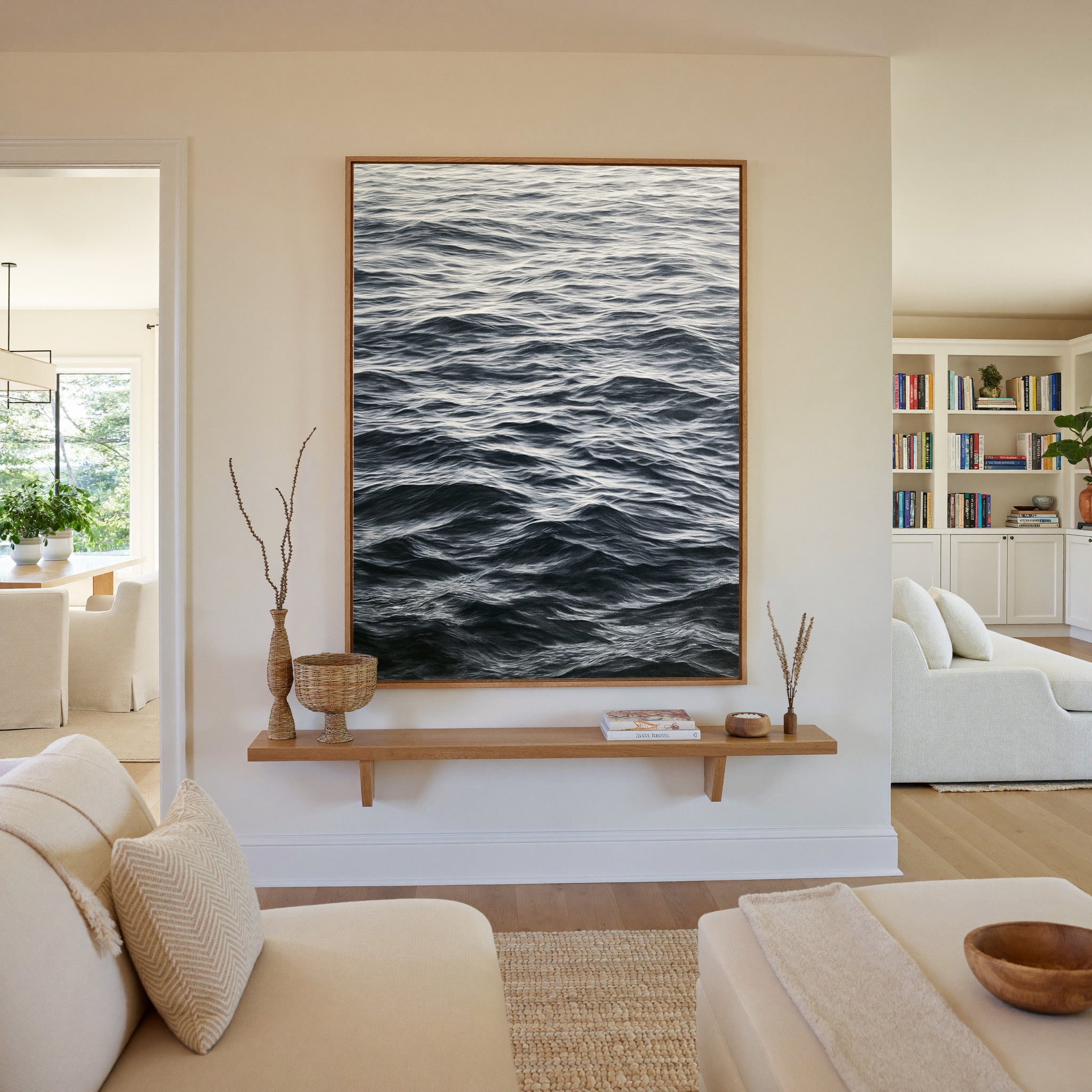 dark rippling ocean water canvas wall art in an oak frame in a living room
