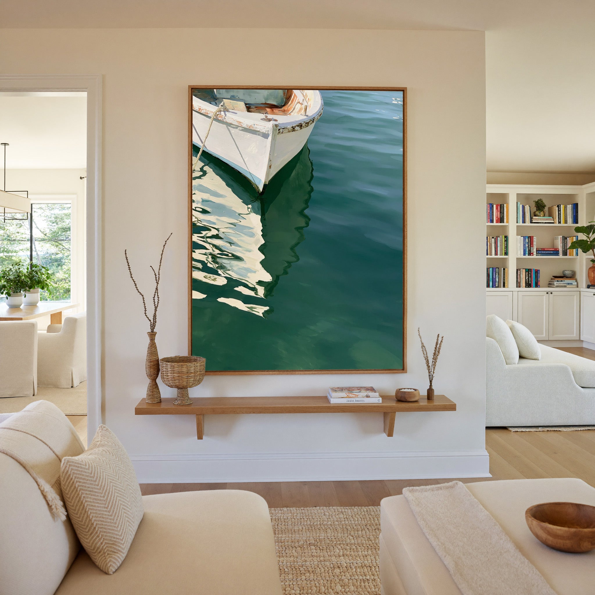 cropped white bow over deep green water canvas wall art in an oak frame in a living room