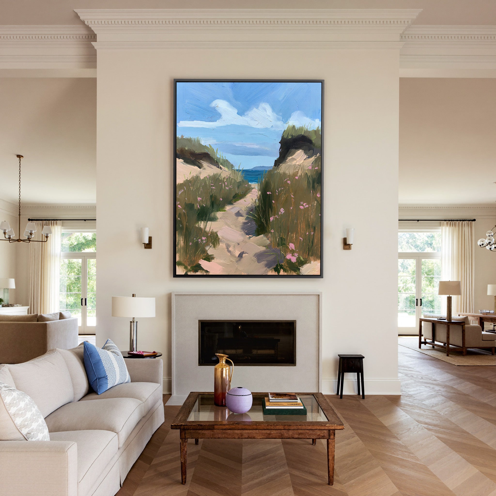 windswept coastal path with dune grass and pink canvas wall art in a black frame above a mantel