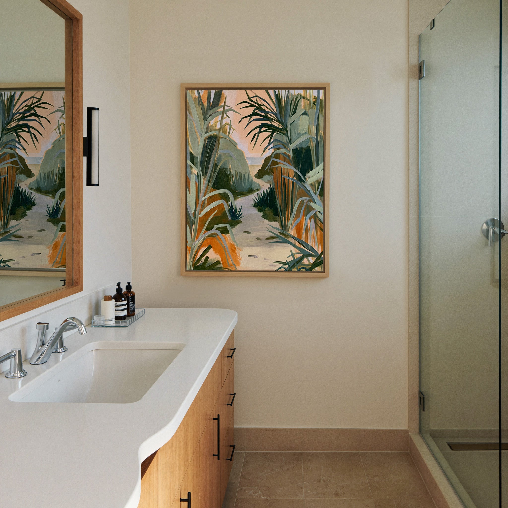 sandy path between tall coastal grasses canvas wall art in a natural wood frame in a styled room setting