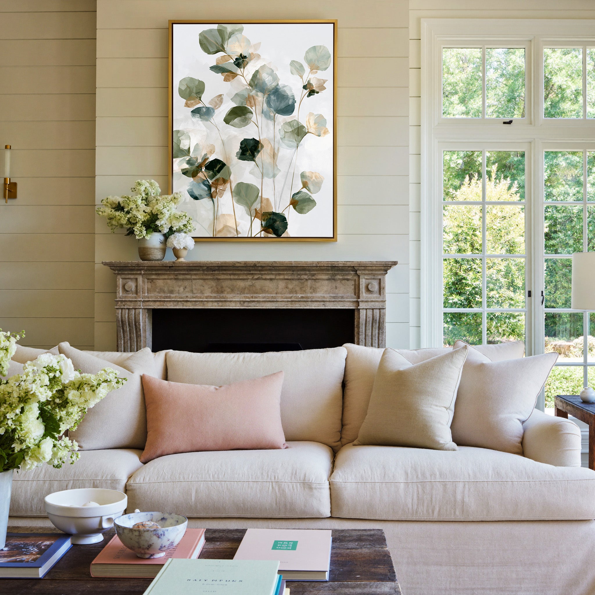 soft eucalyptus like leaves in sage, blue gray, canvas wall art in a gold frame above a mantel