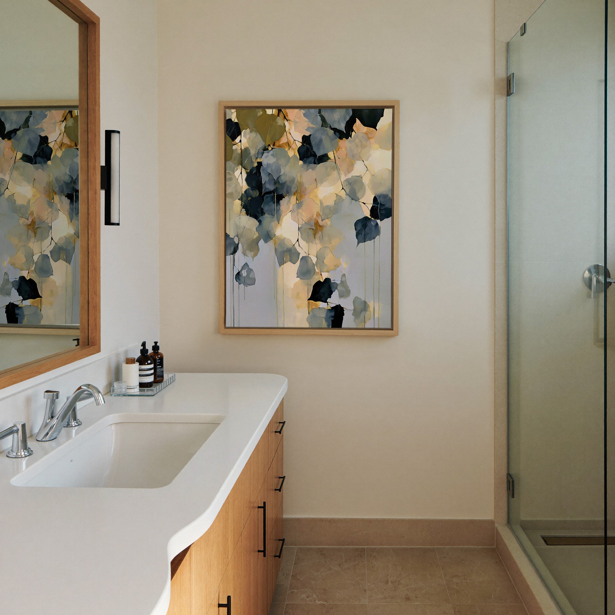 soft blue gray and gold abstract with hanging canvas wall art in a natural wood frame in a styled room setting