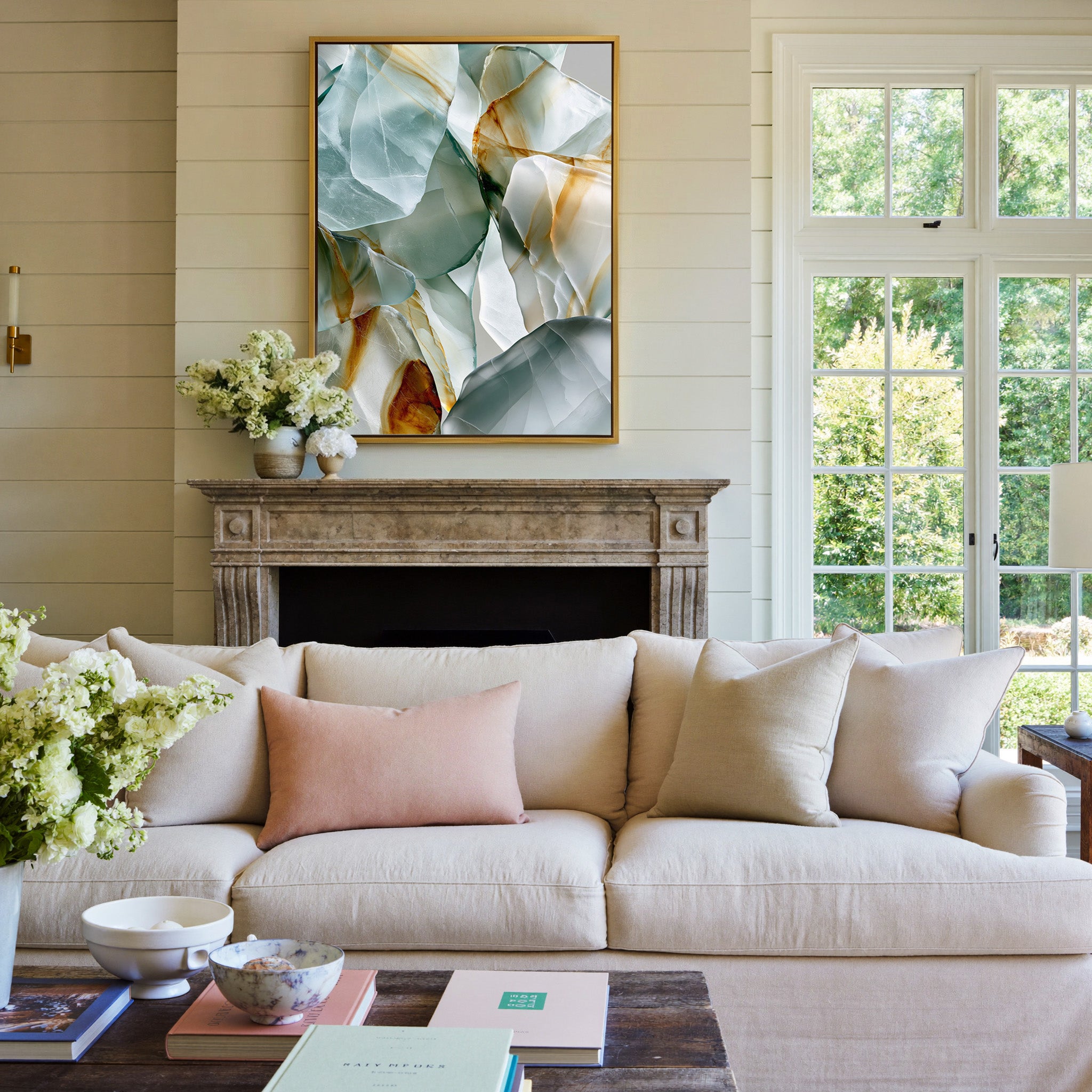 soft sea glass abstract with pale aqua, white, canvas wall art in a gold frame above a mantel