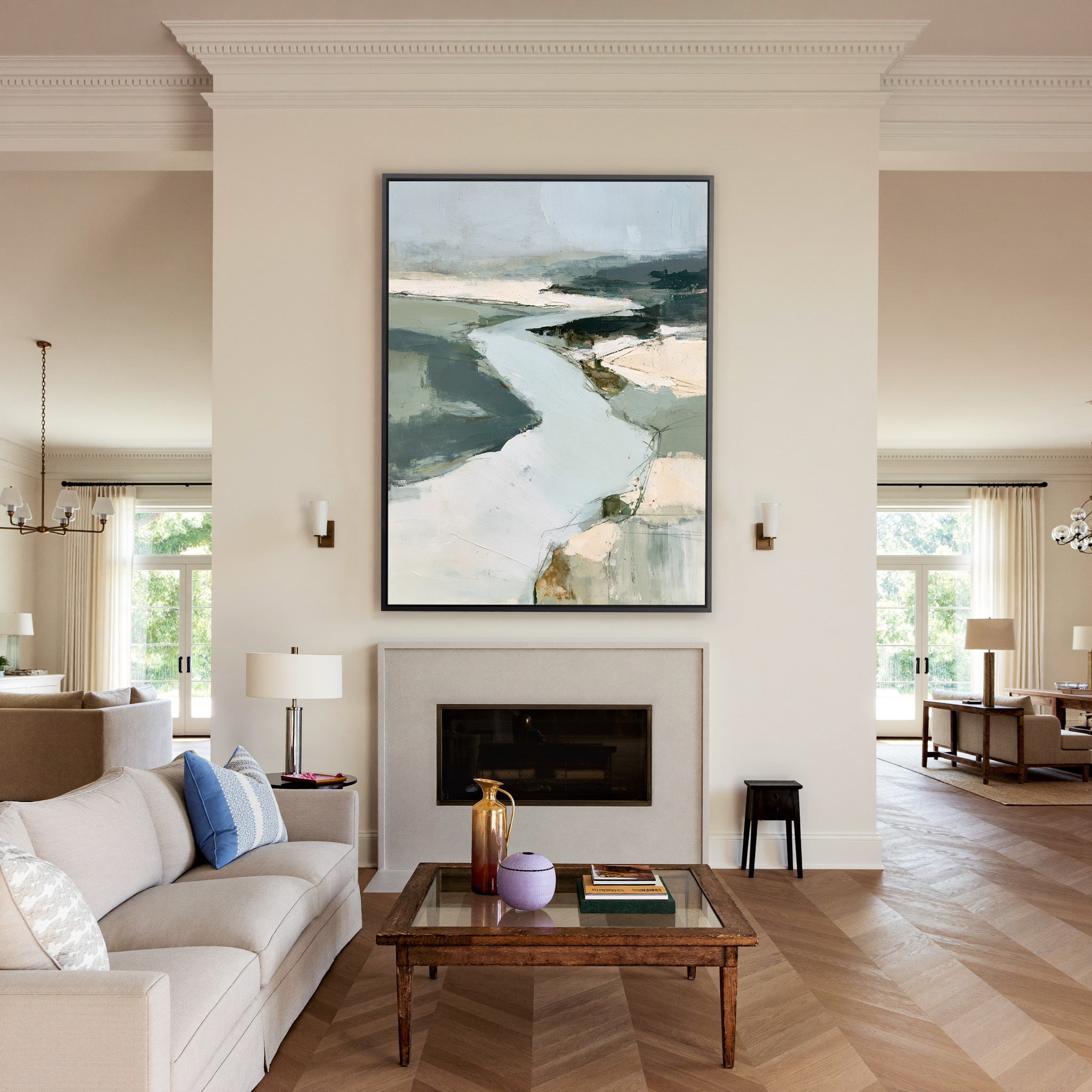 broad pale channel with slate green banks canvas wall art in a black frame above a mantel
