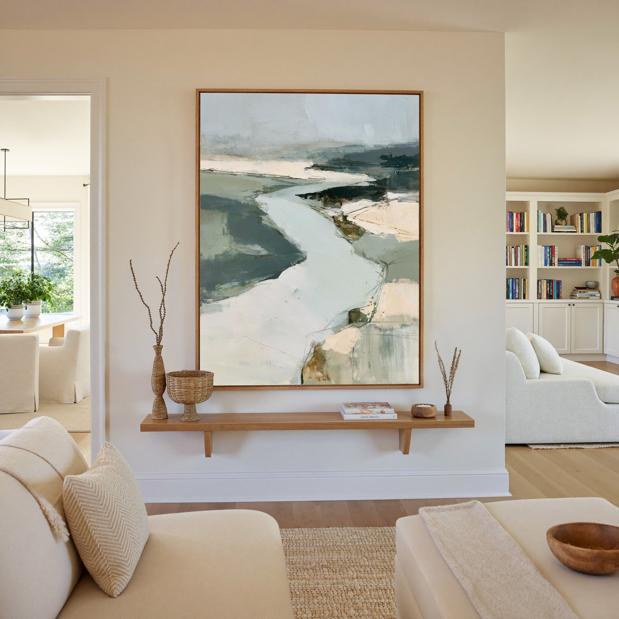 broad pale channel with slate green banks canvas wall art in an oak frame in a living room