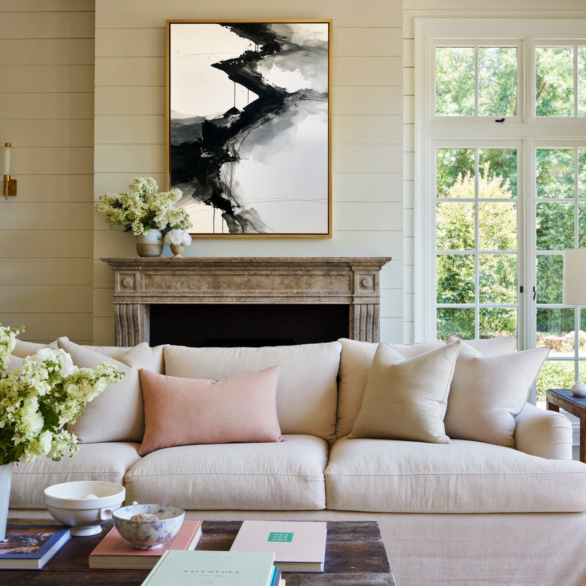monochrome abstract with diagonal black bands canvas wall art in a gold frame above a mantel