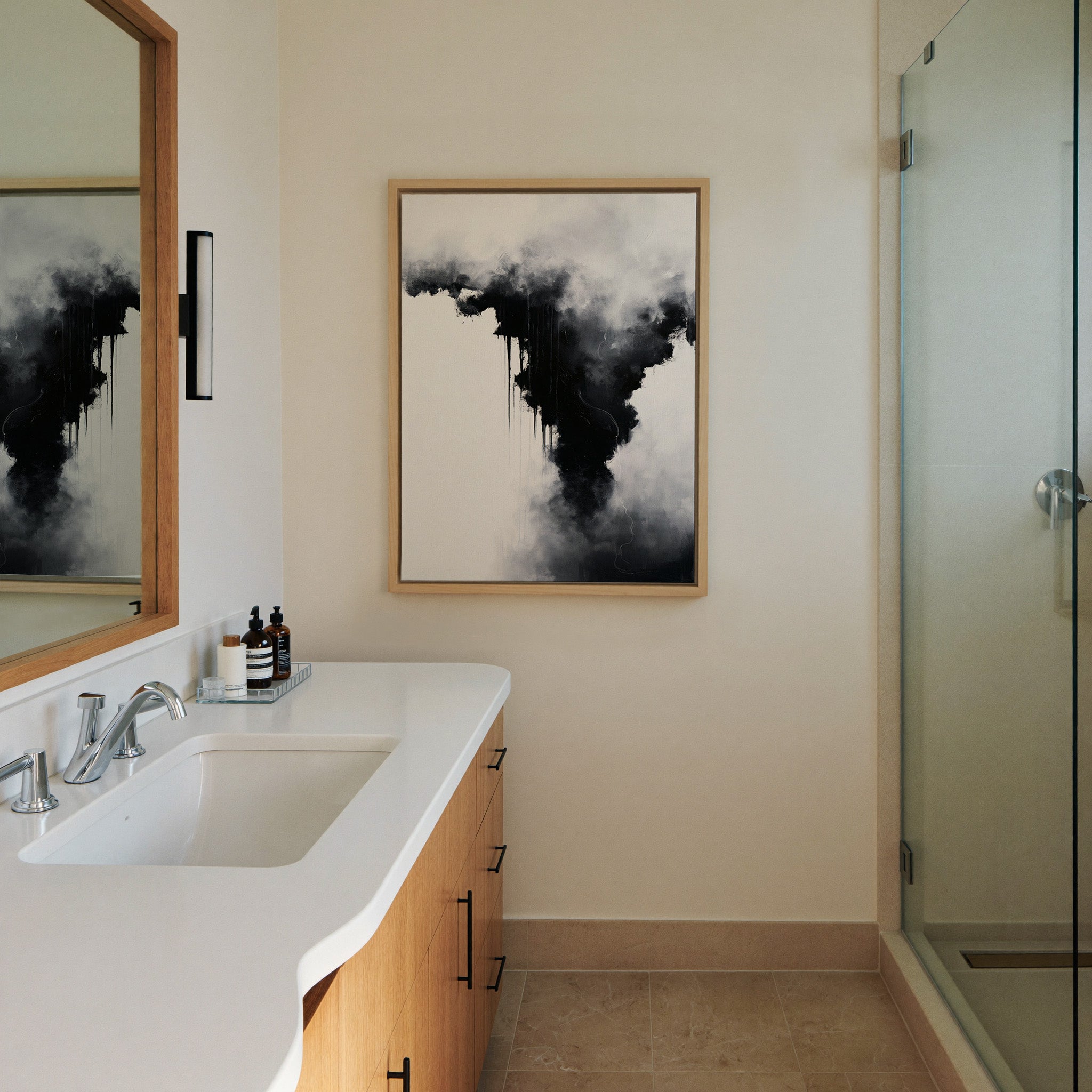 black and white abstract with canvas wall art in a natural wood frame in a styled room setting