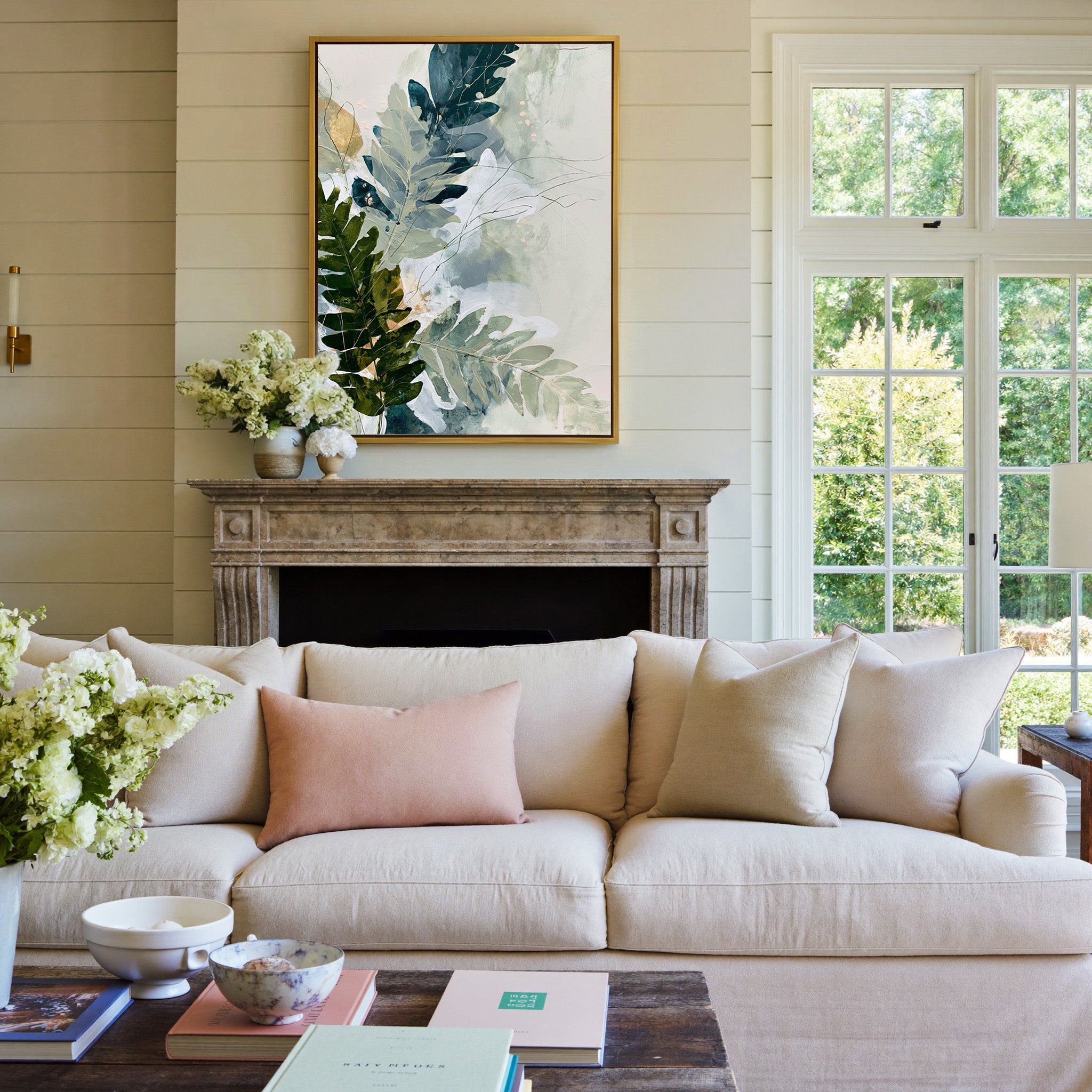 layered fern leaves in sage, moss, slate blue, canvas wall art in a gold frame above a mantel
