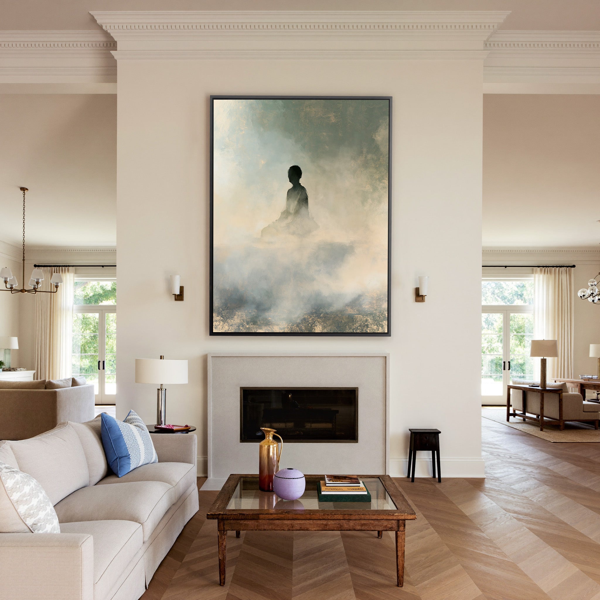 soft gray and cream seated silhouette canvas wall art in a black frame above a mantel