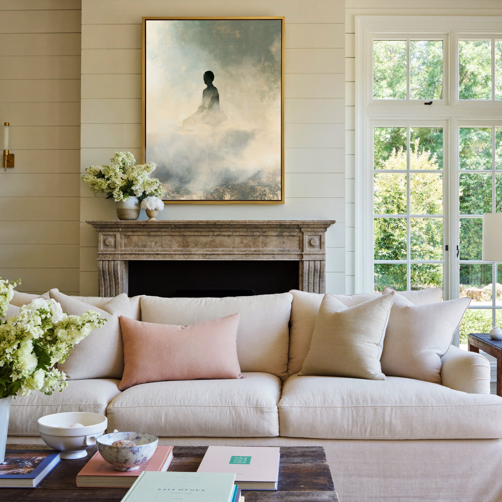 soft gray and cream seated silhouette canvas wall art in a gold frame above a mantel