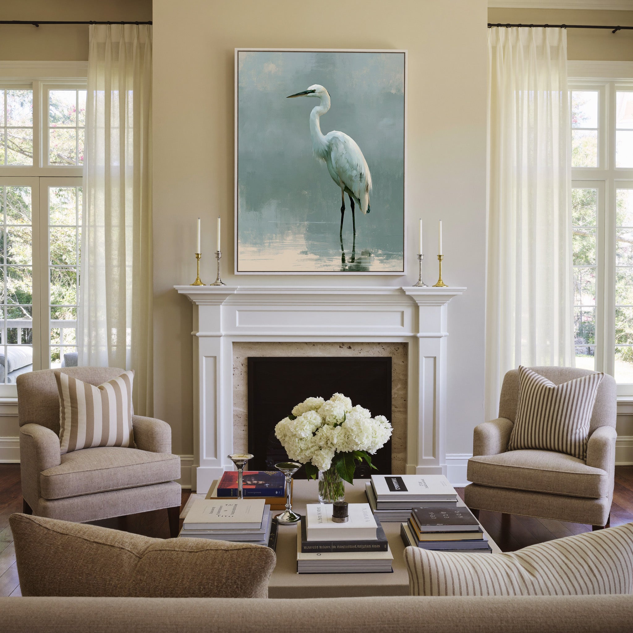 white heron in pale reflective water canvas wall art in a white frame above a mantel