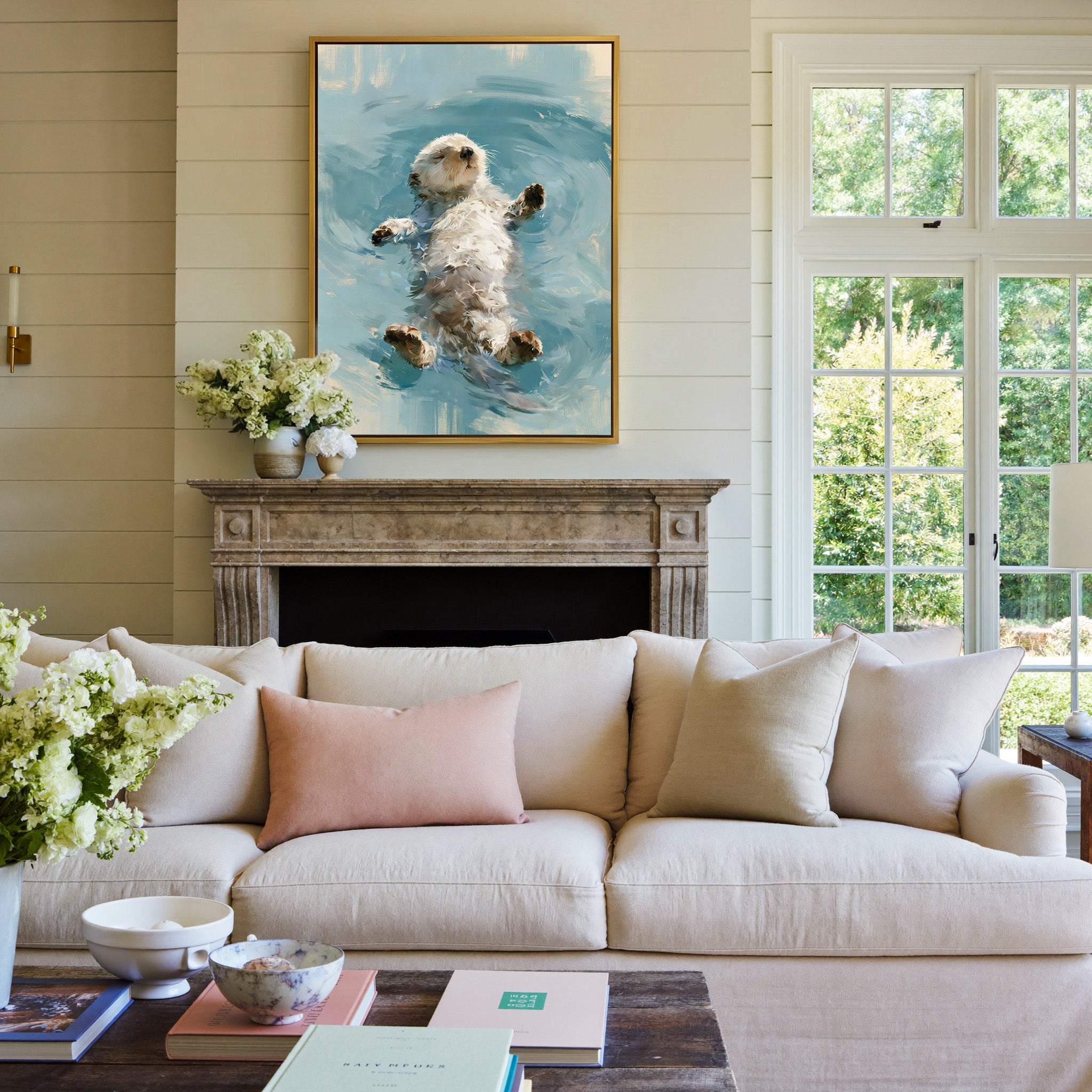 small otter floating on its back in soft gray canvas wall art in a gold frame above a mantel