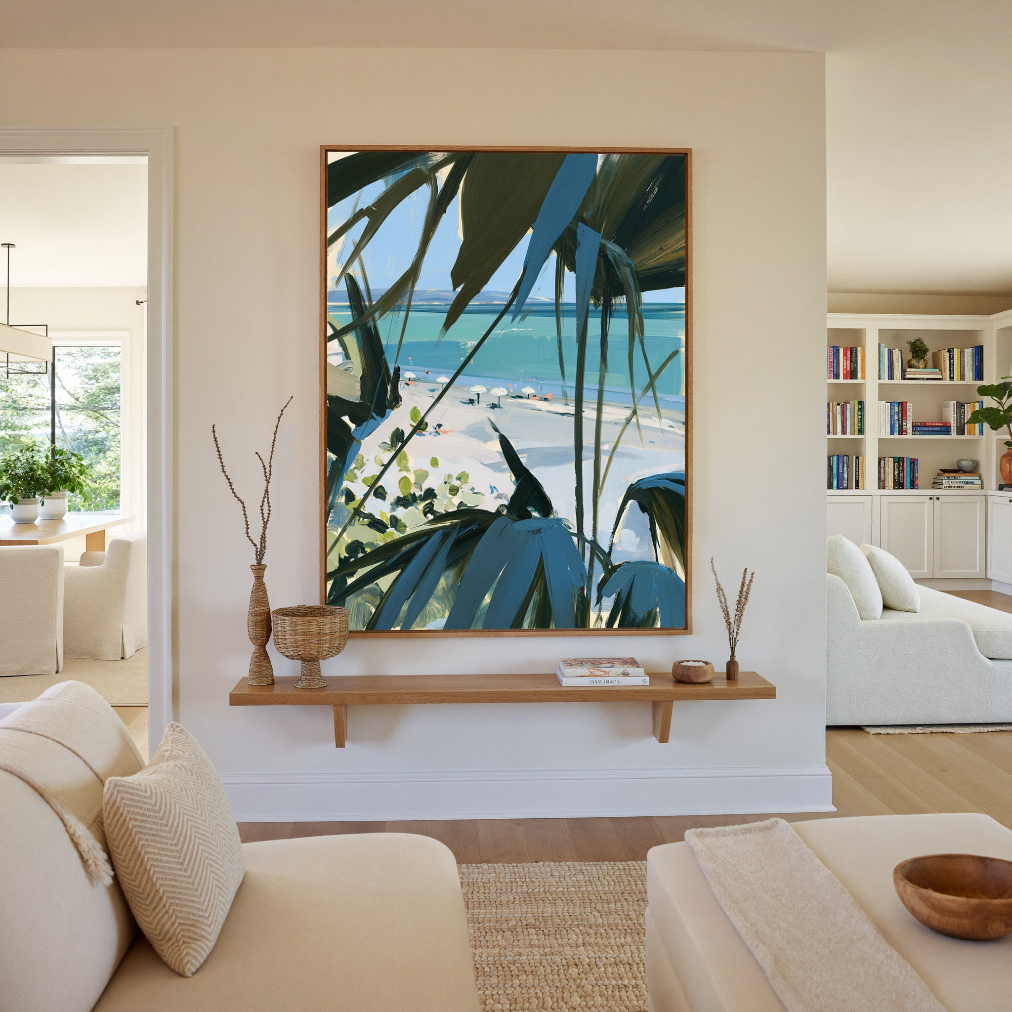 beach view through dark palm fronds canvas wall art in an oak frame in a living room