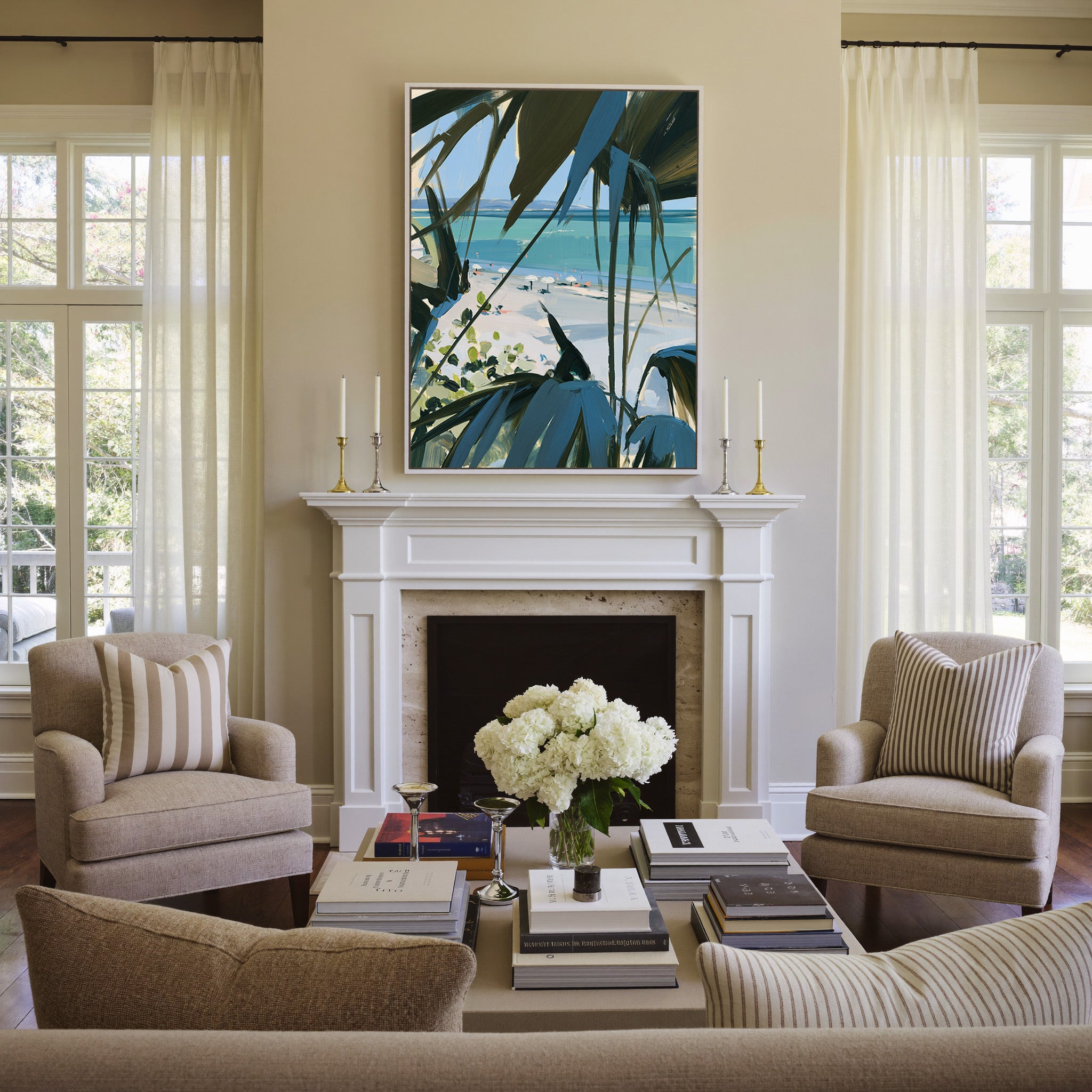 beach view through dark palm fronds canvas wall art in a white frame above a mantel