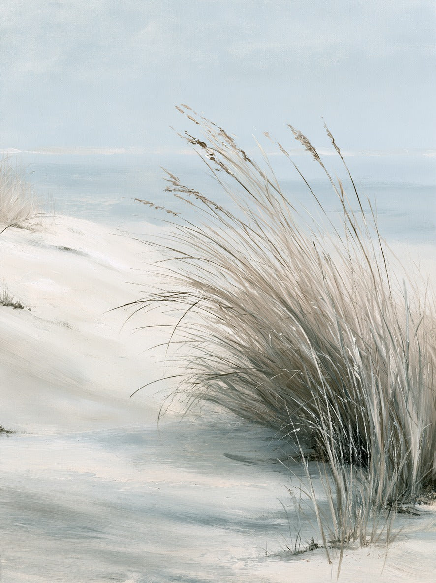 Pale dune grass leaning over soft blue water and bright sand under an open sky